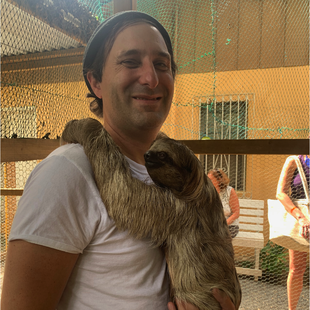 Jamie with the sloth. This is like someone's family business rescuing weird animals.