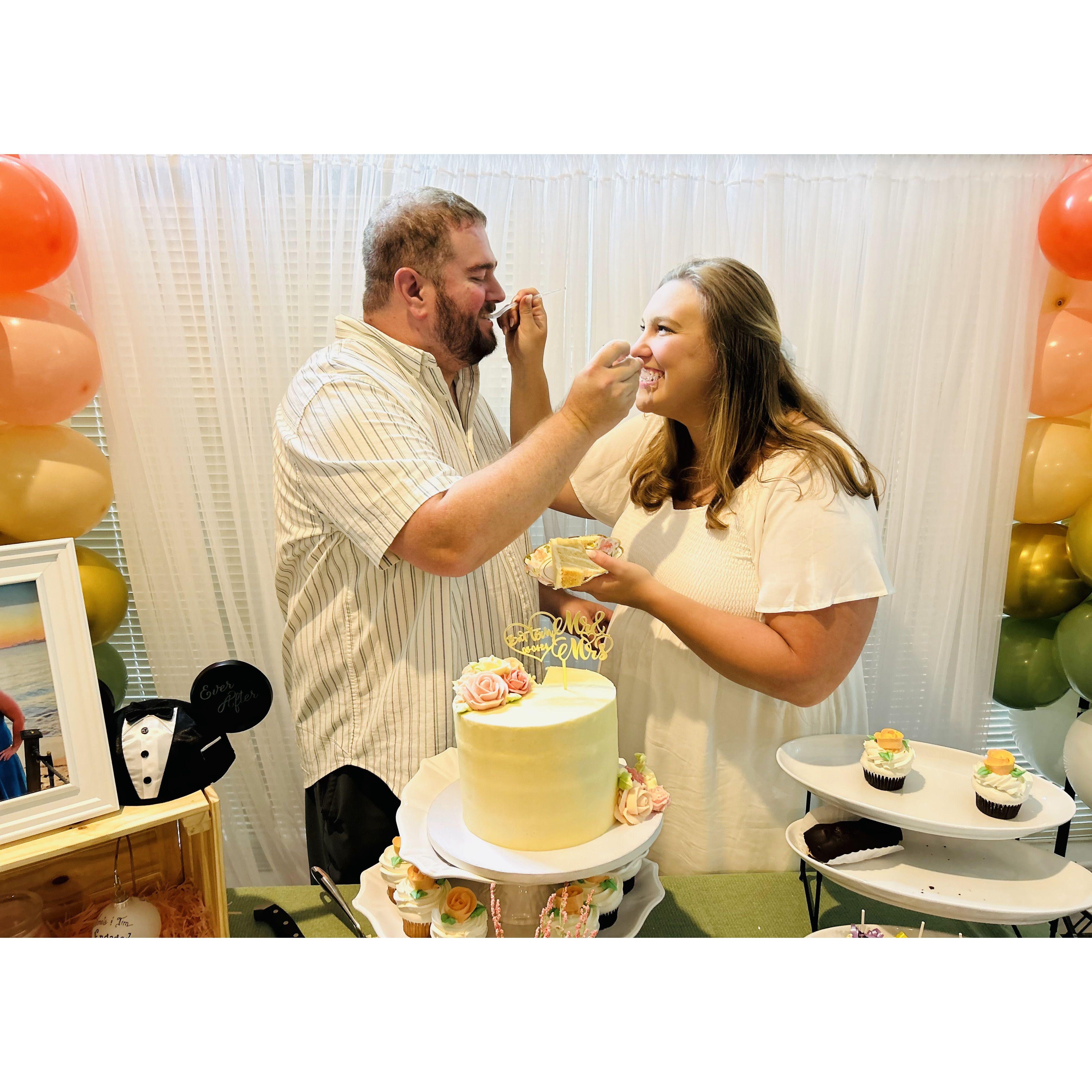 Practicing our cake cutting at our engagement party