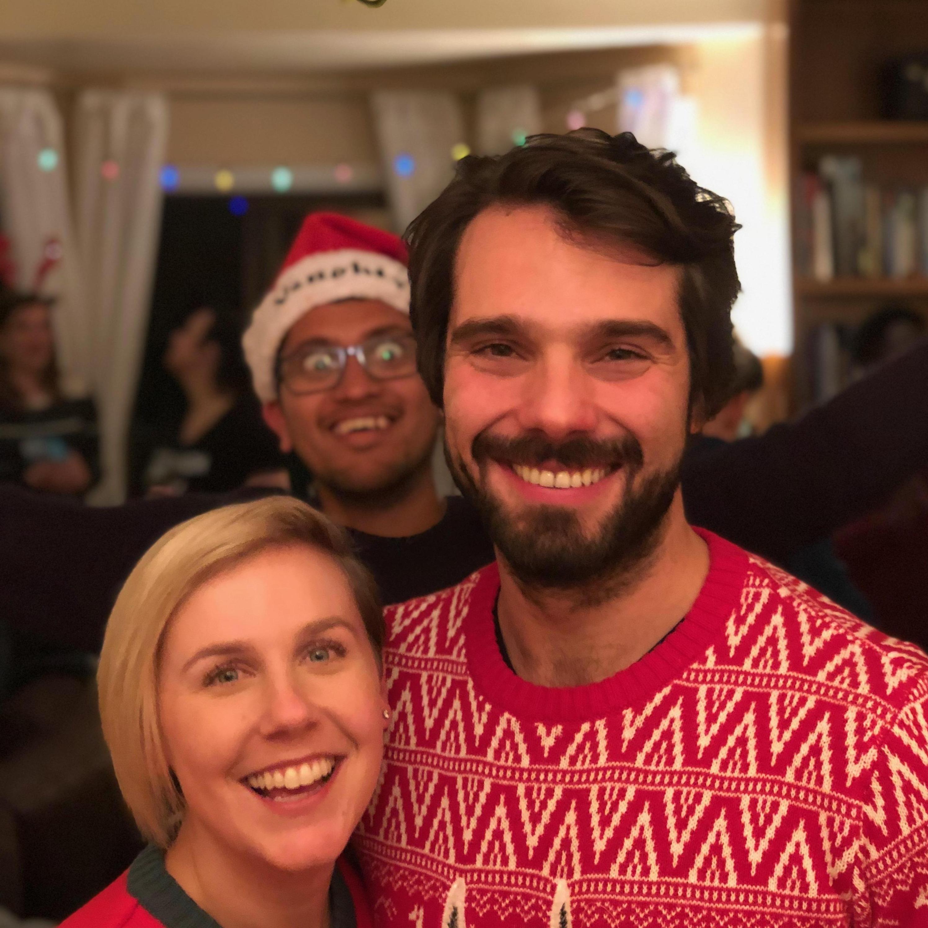 Beautiful photo bomb from Santosh  -- we won a giraffe haiku/painting that night. White Elephant Party @ Bre & Brendans - December 2018.