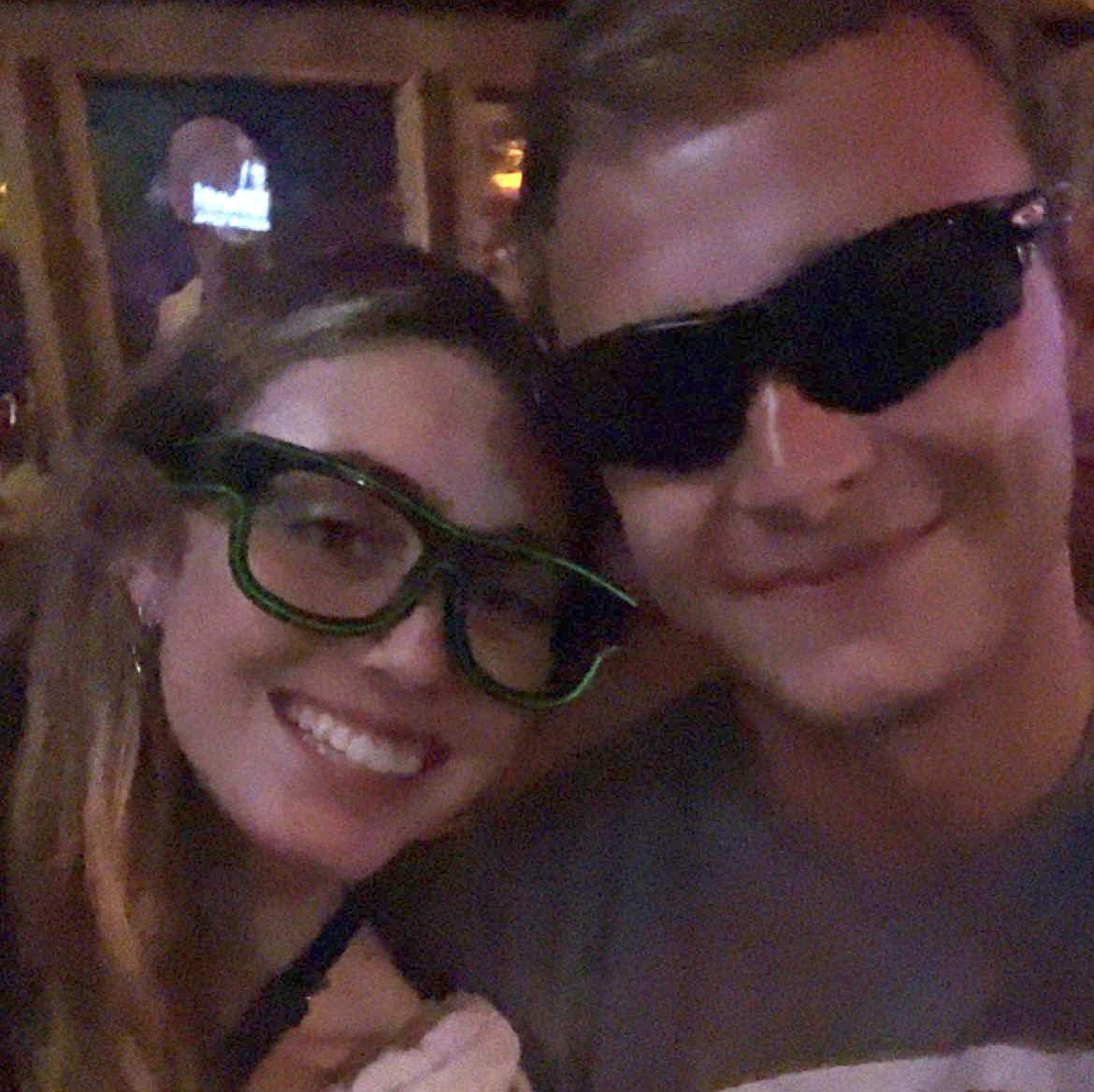 The night we met, at slugger's. Gabby is rocking the DJ's shades & John is rocking someone's slick shades