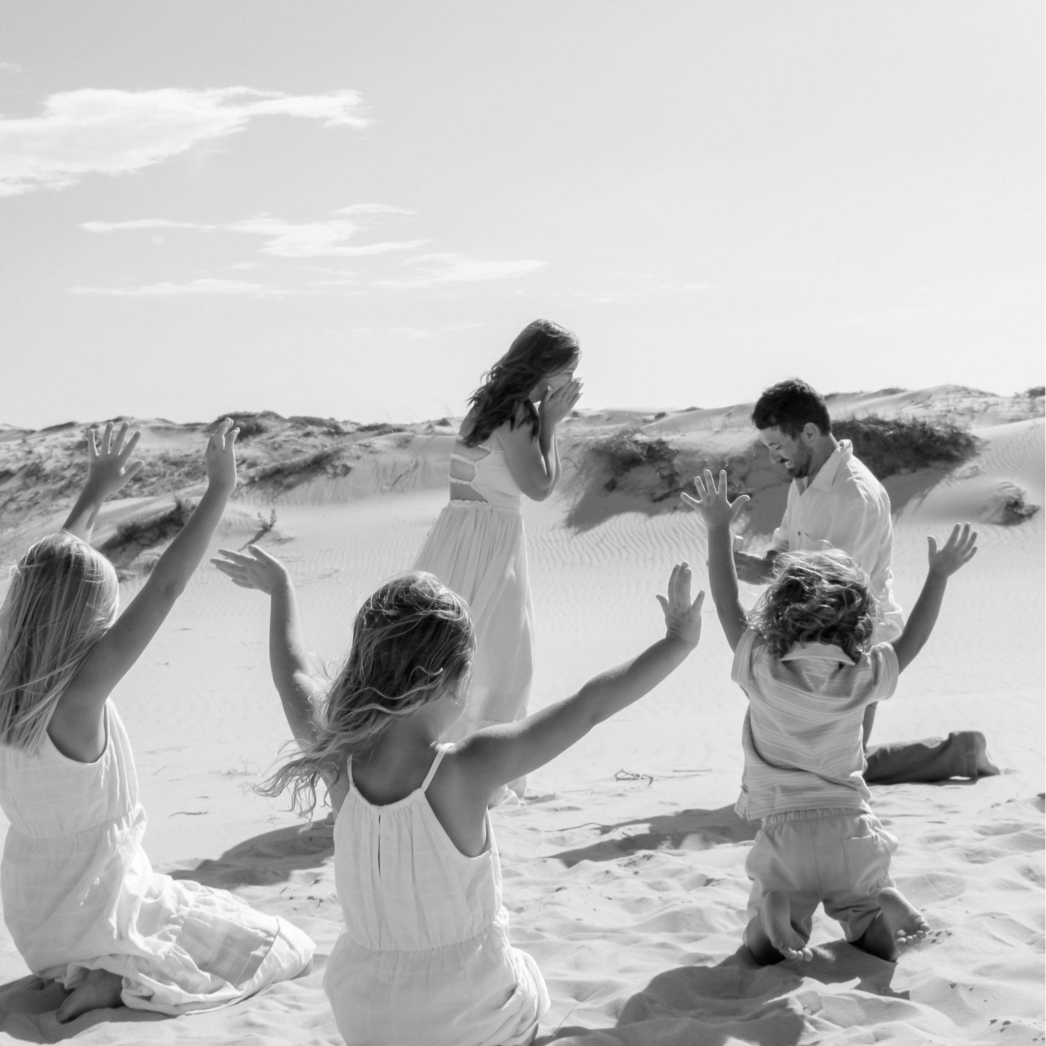 Fun Fact. We had to reenact the proposal because the kids were rolling down the sandhills during the real deal.