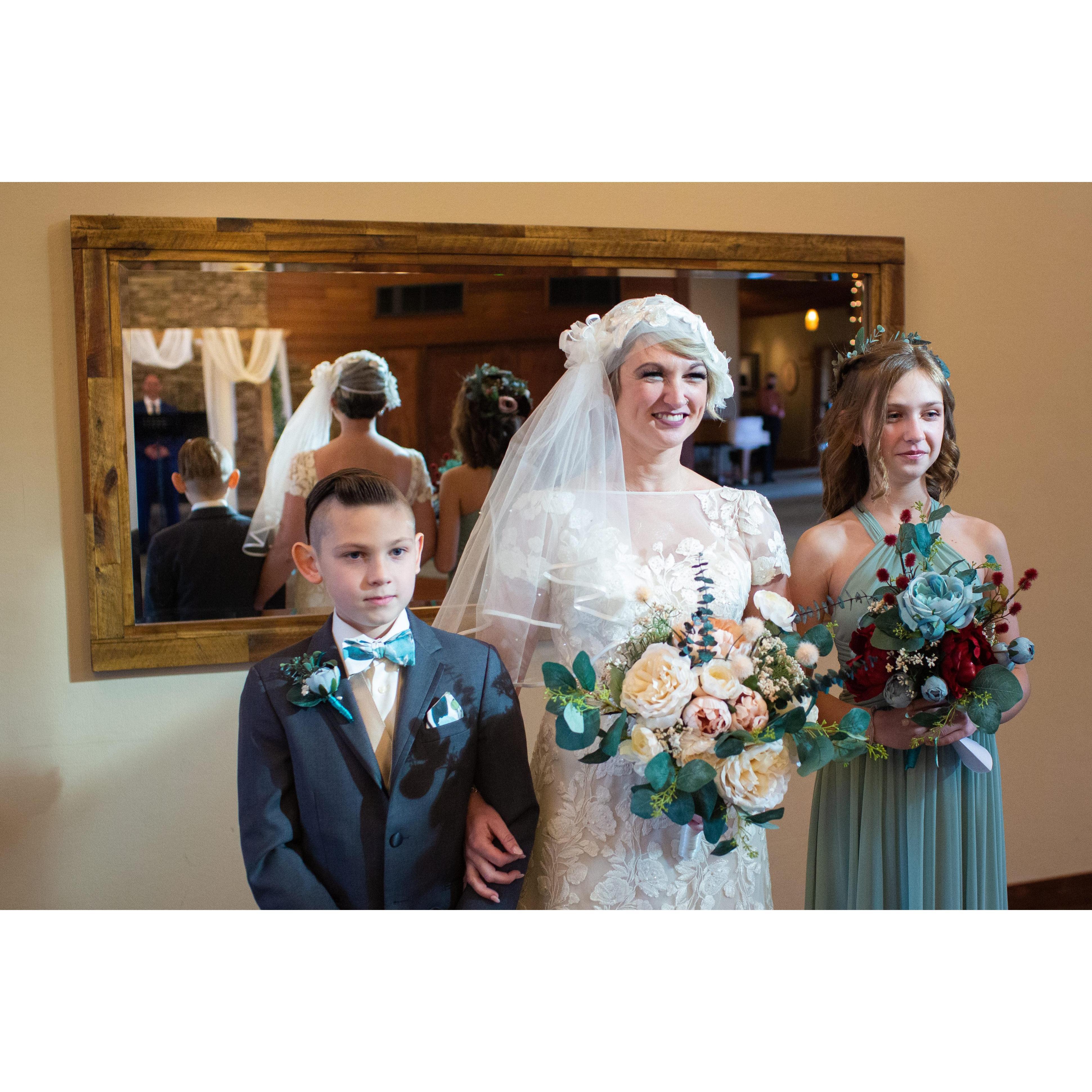 On our wedding day, we had storms roll in just before the ceremony. Right before the kids and I walked down the aisle, the sun shown through a small window in the ceiling and directly on to us!