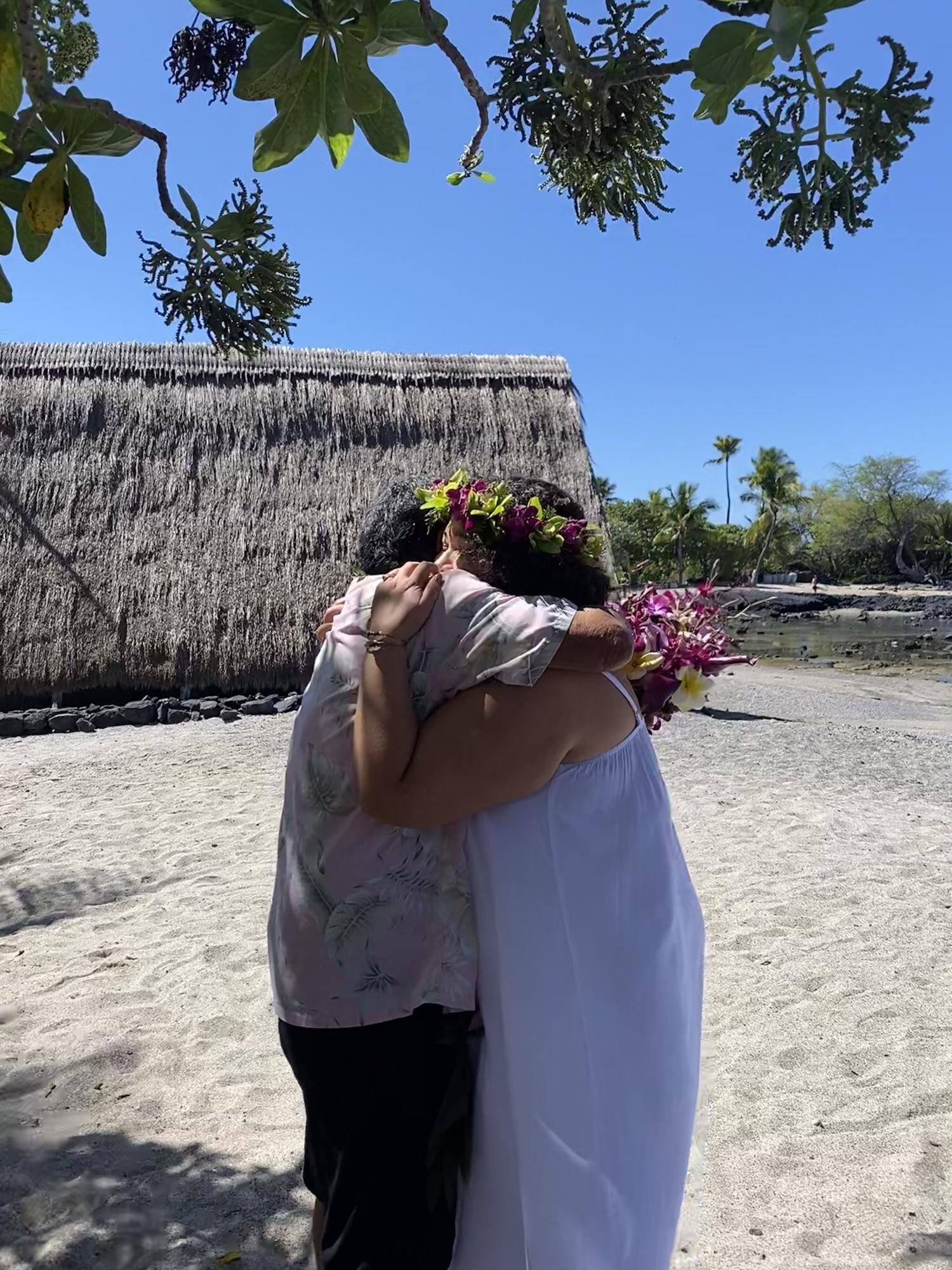 Robert and Leilani embrace post ceremony