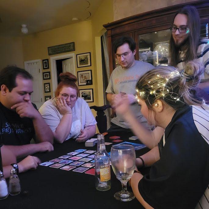 Game night at the Hill household! Pictured: Jacob, Rebecca Moore, Tristen, Nathanael, and Emily