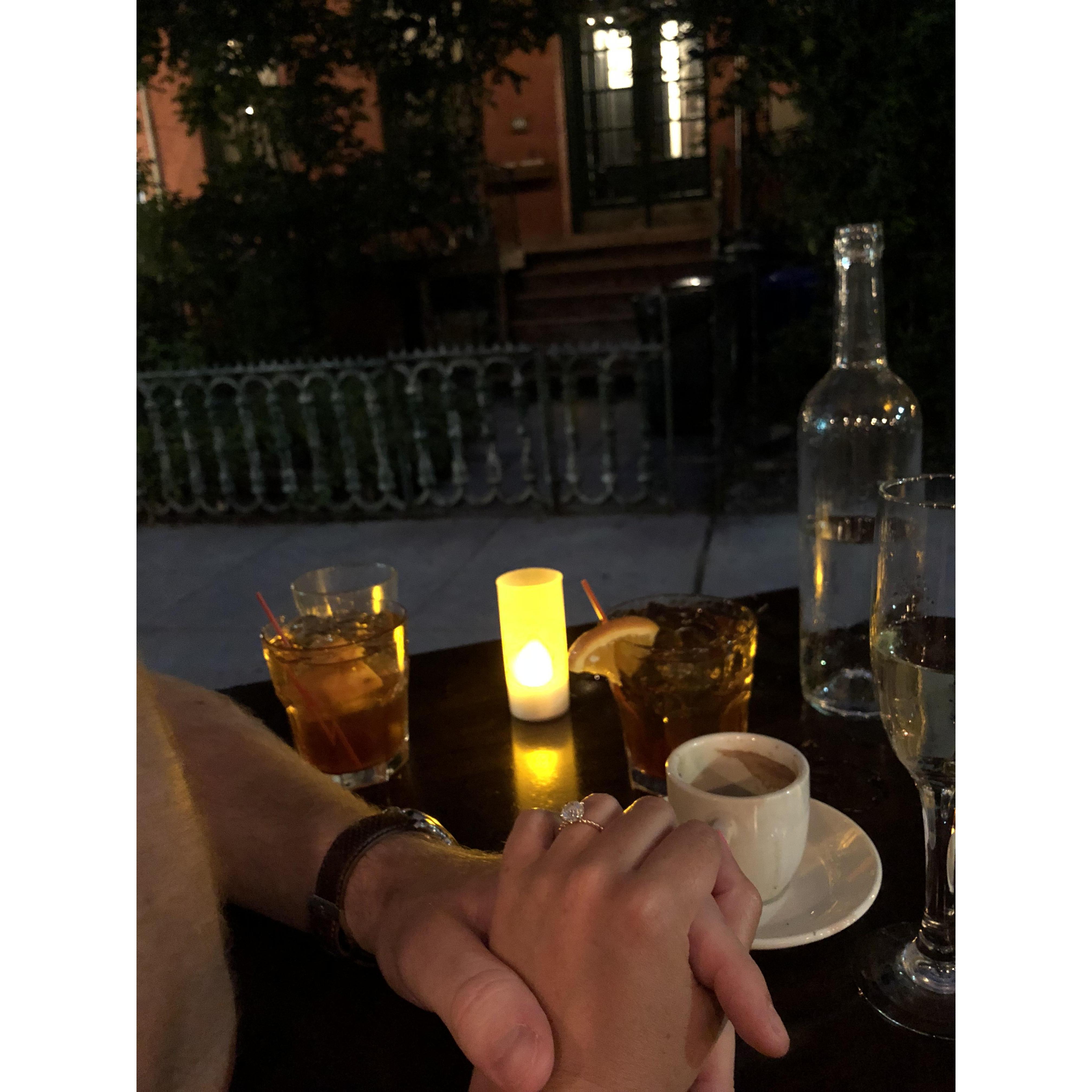 Sitting directly in front of our first apartment together for our engagement dinner - July 24, 2020