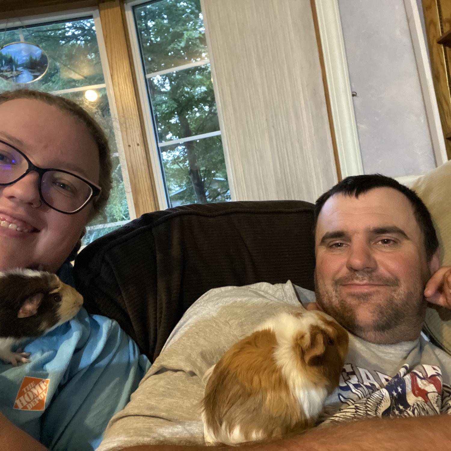He was so adamant he wanted nothing to do with our Guinea Pigs! I'd say this picture says differently!