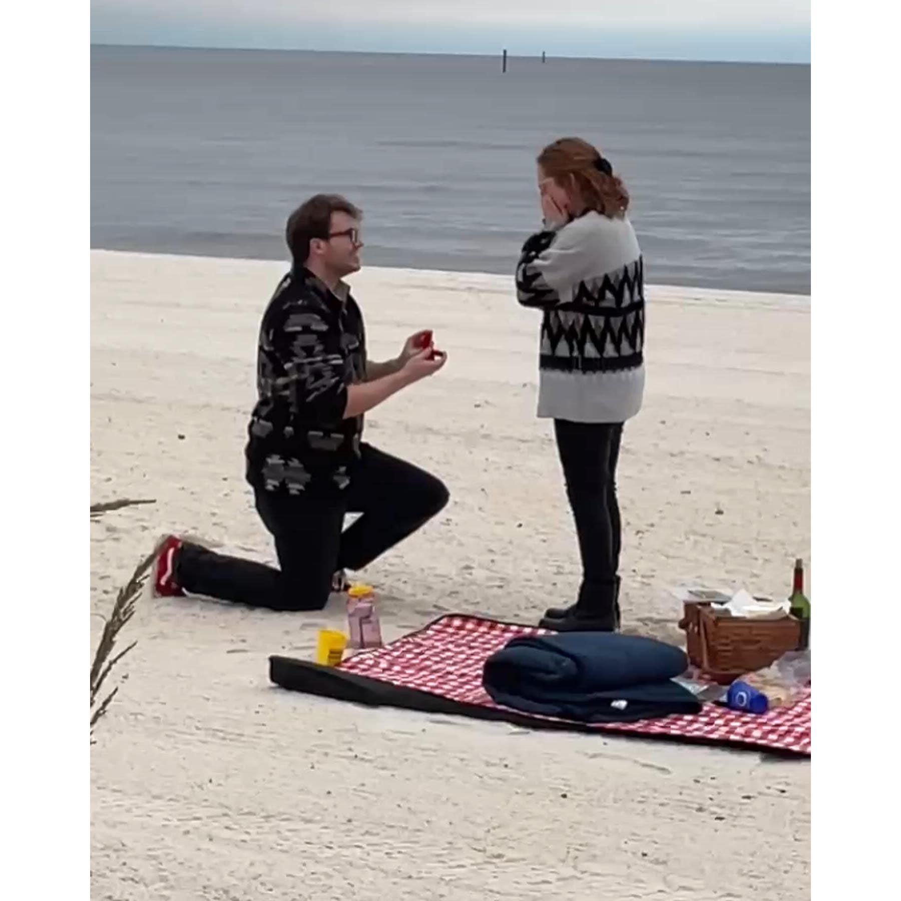 When he proposed! He played our song and we had a picnic by the beach. He was showing me the lighthouse. I turned around and he was on one knee!