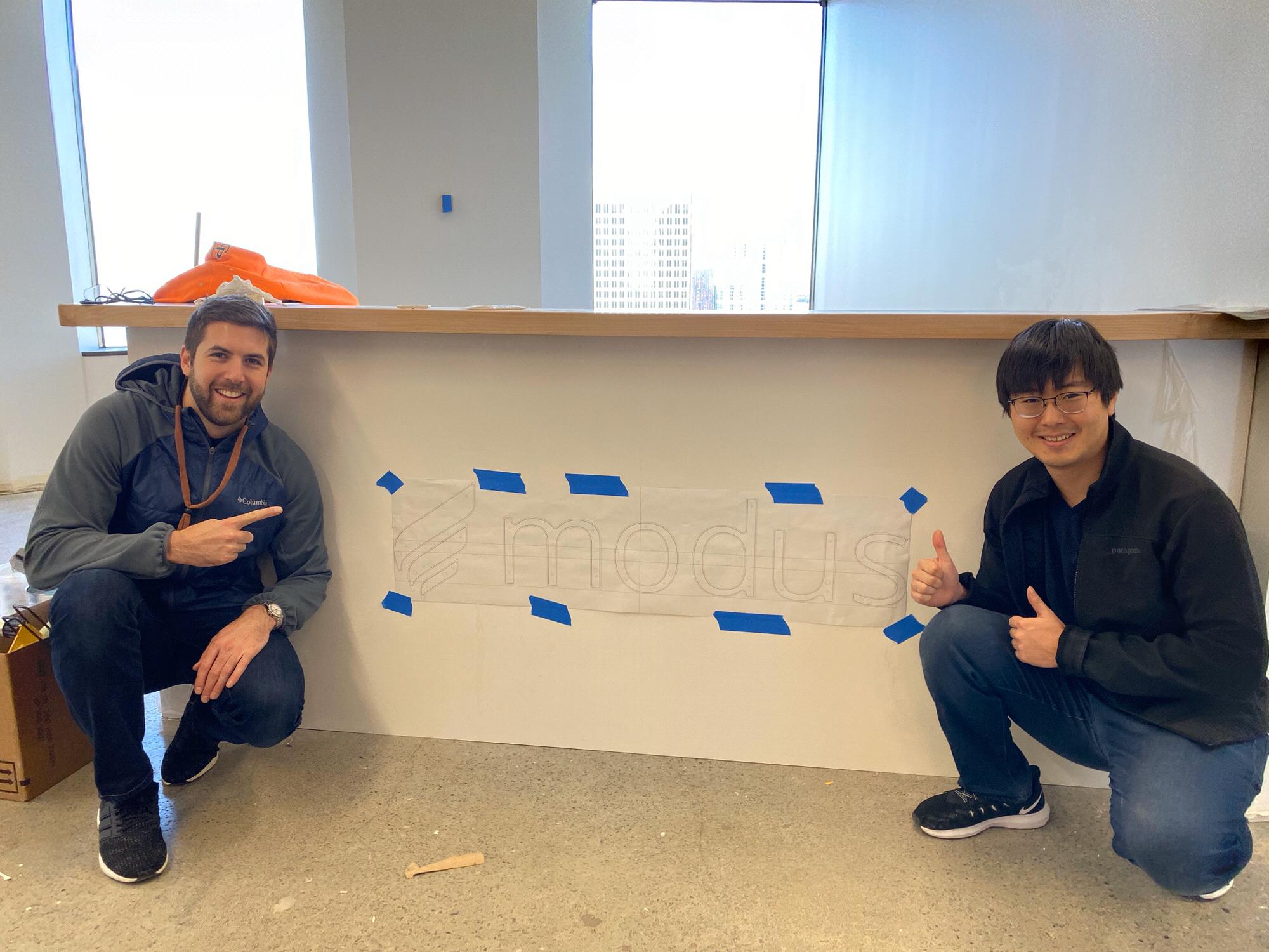 Alex and Jai at their company Modus’s new office space! 33rd floor in downtown Seattle.