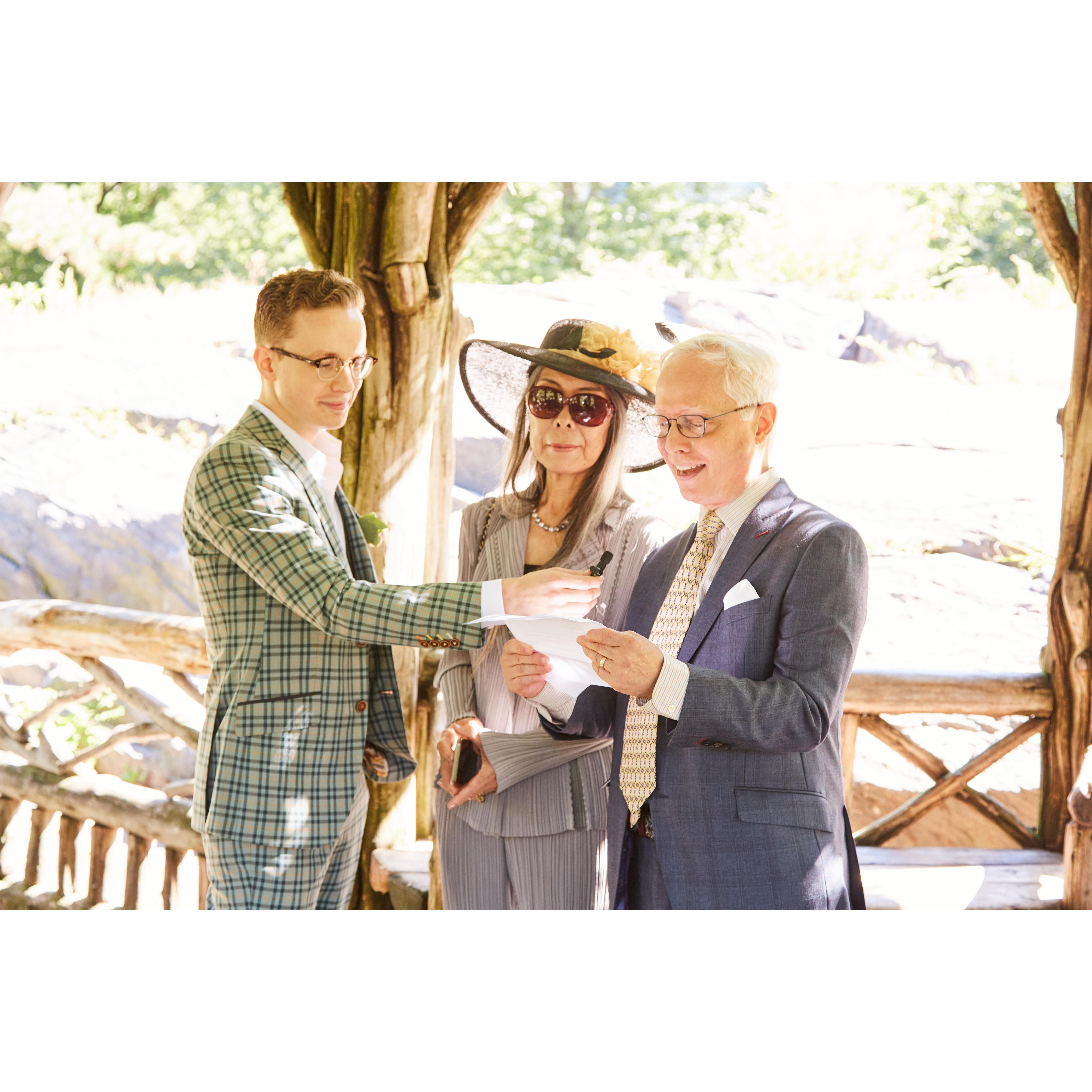 Nicholas and Misuzu present their reading for the bride and groom.