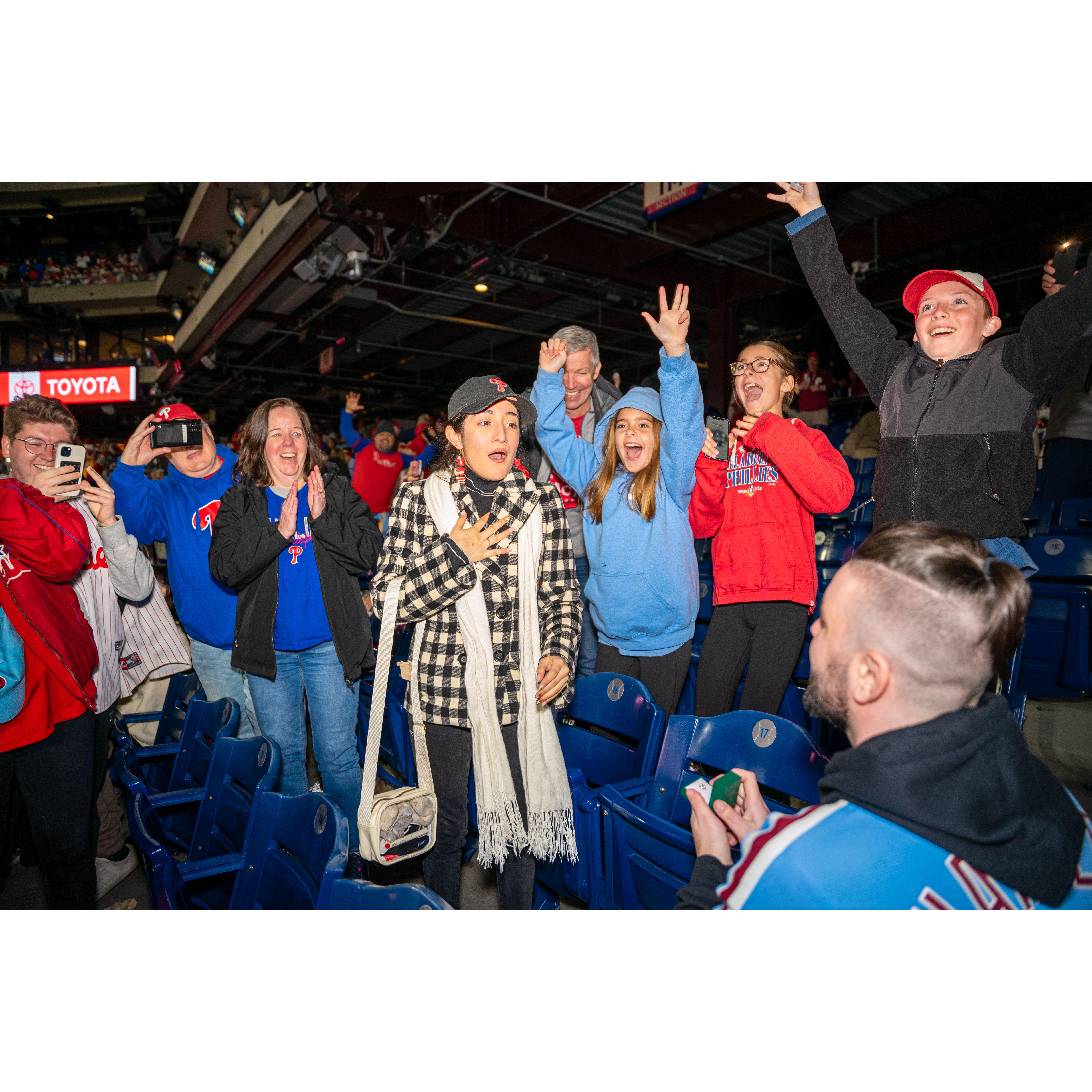 Yolany staring shockingly at Jonathan as he proposes.