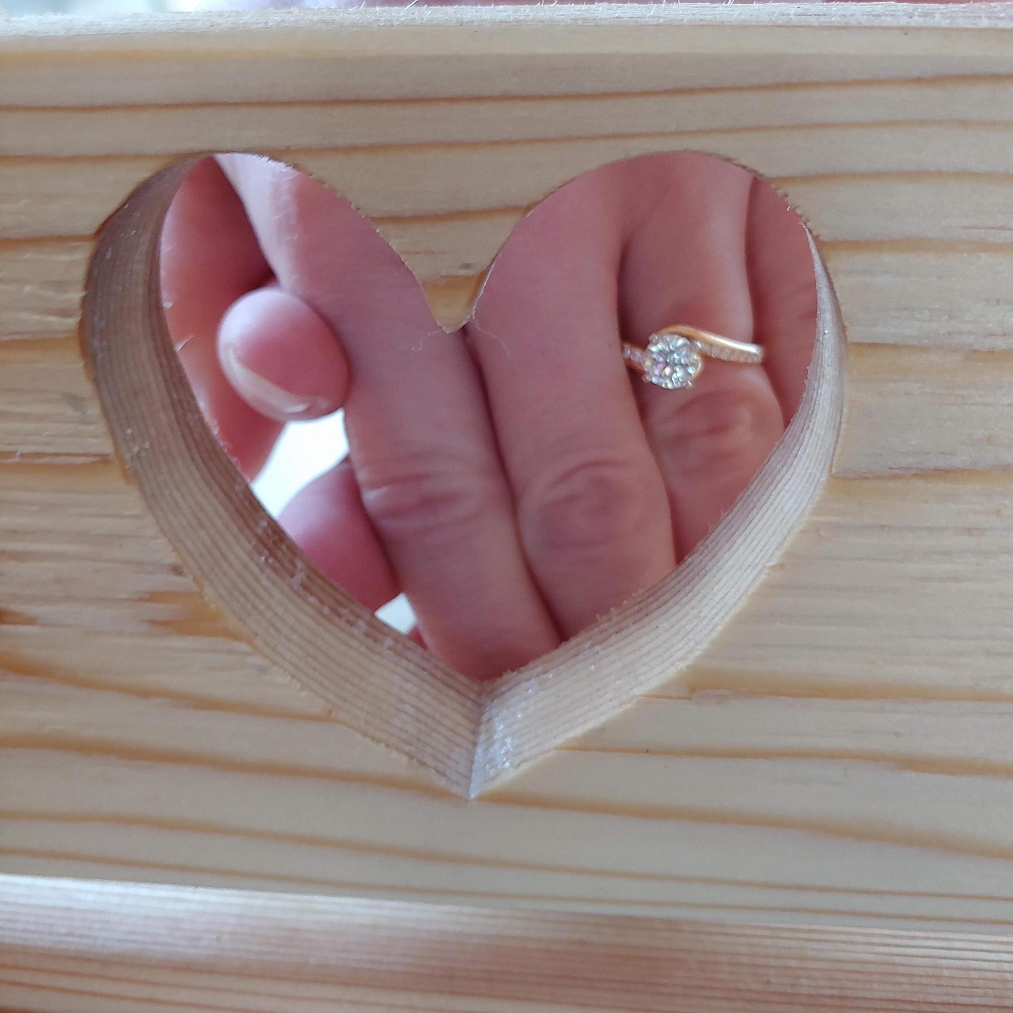 This photo features the heart we carved in a porch swing we built together!