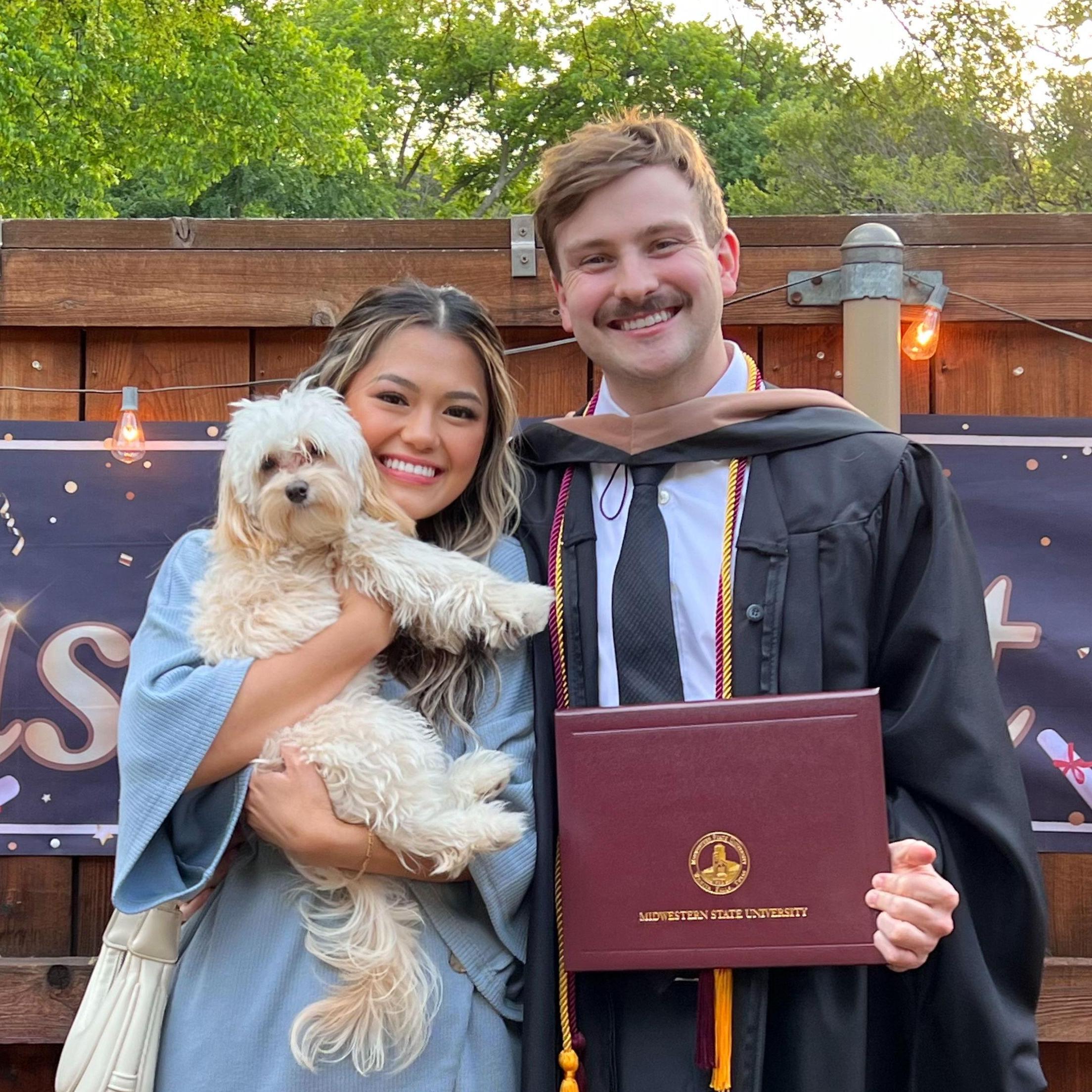 Collin graduating with his MBA, Finley getting his Dog-torate