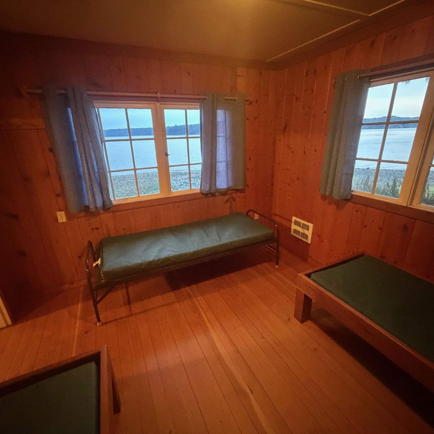 Bedroom with three bunks inside "Staff Cabin"