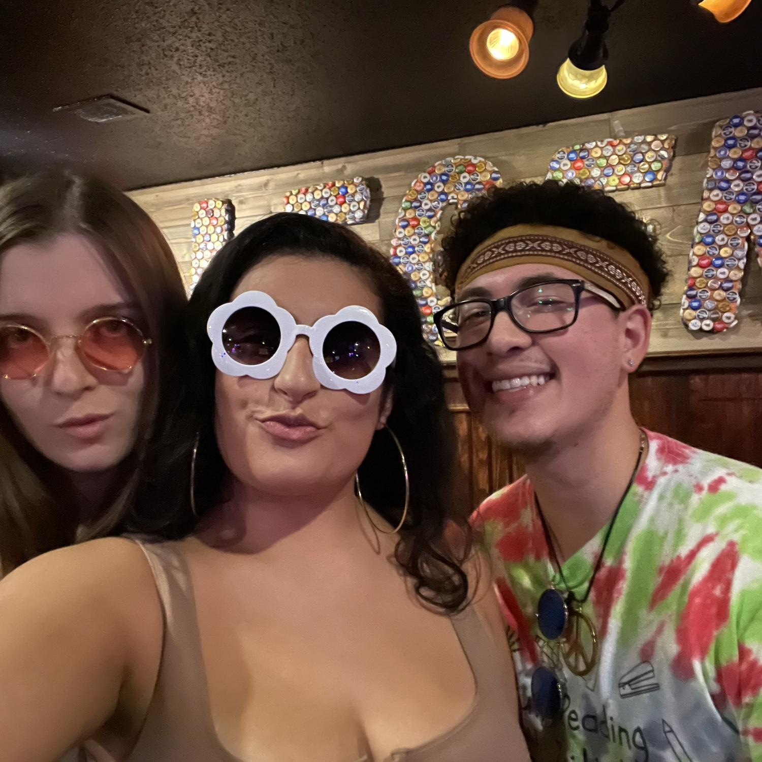 Kaylie (bridesmaid) and us as Hippies for Halloween 2022!