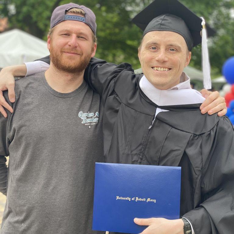 Donovan graduated from his masters at Detroit Mercy in May 2023. Pictured here with groomsmen Brett K.