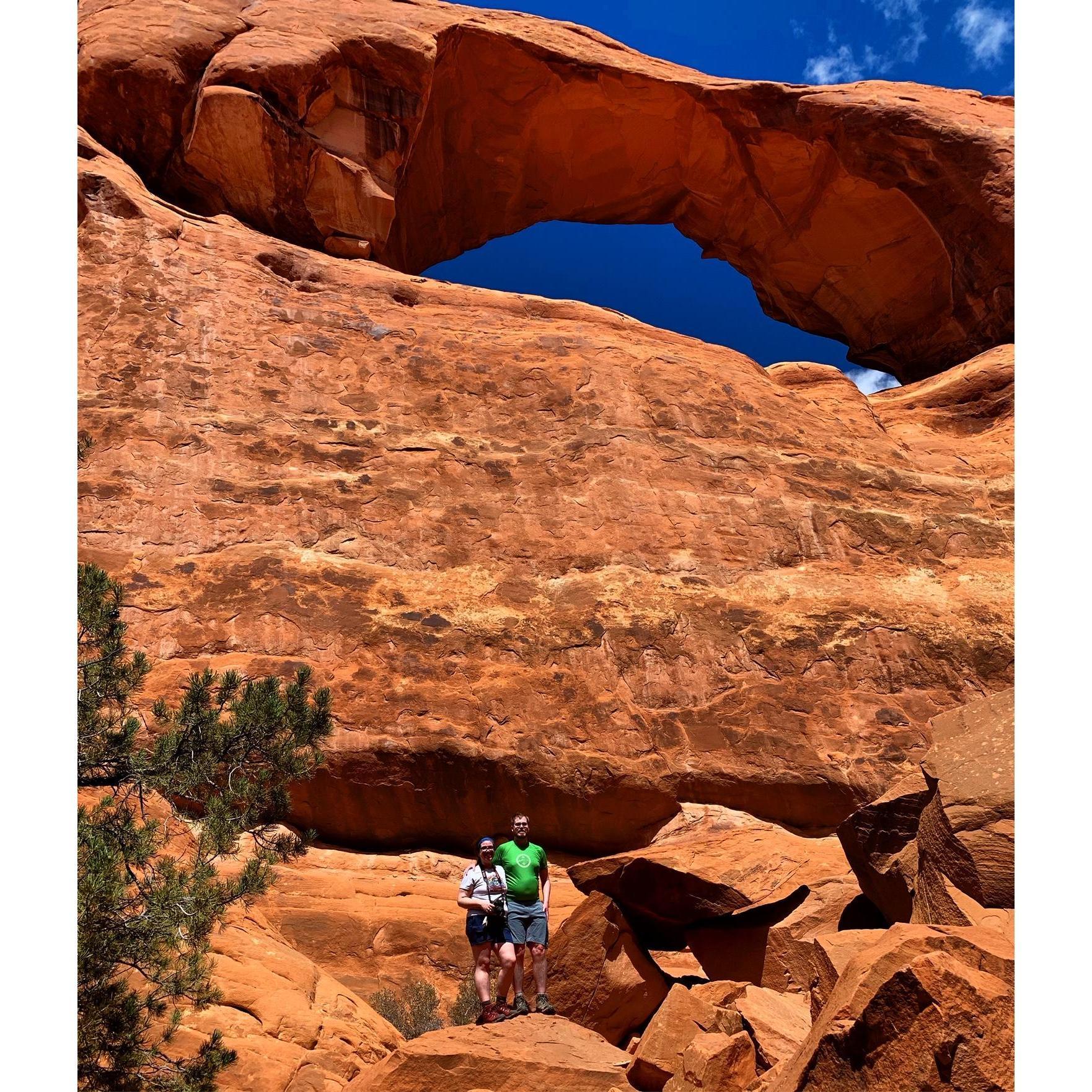 Benji and Lindsay look pretty small under Tower Arch, Arches National Park, Utah