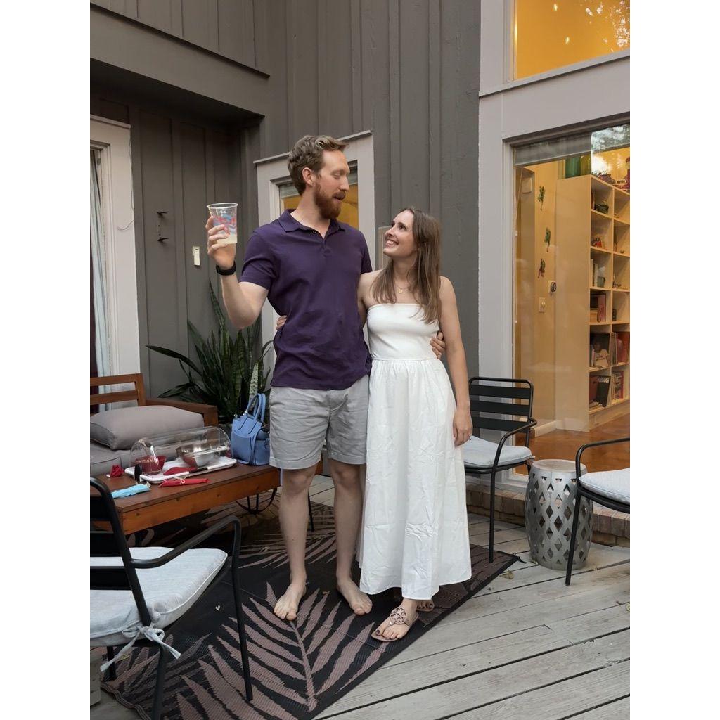 Jesse telling the story of our proposal at our engagment party, 2025