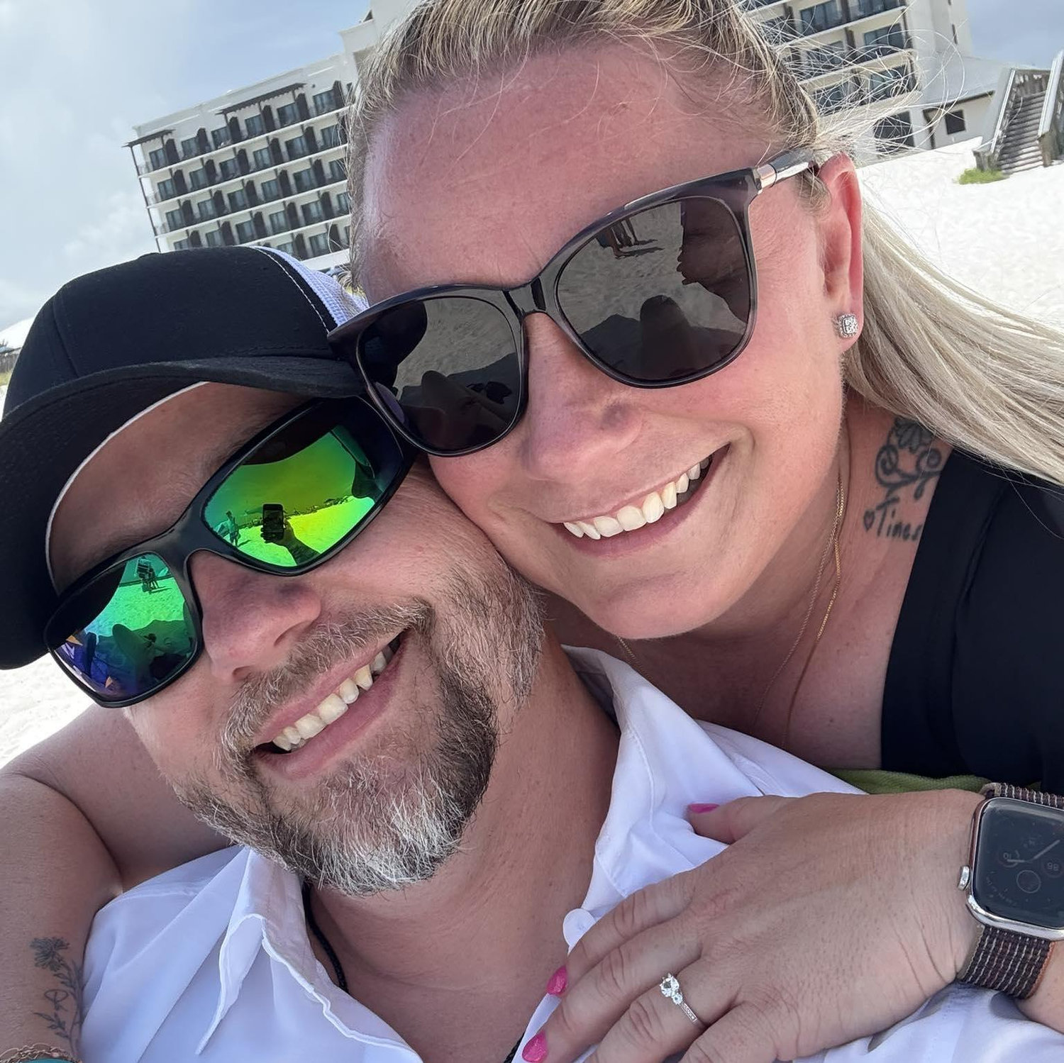On the beach celebrating our proposal!