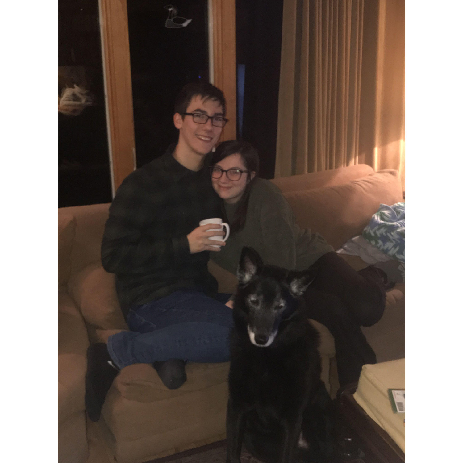 This is one of our favorite photos! Warm and cozy with Nick's late family dog, Rover.