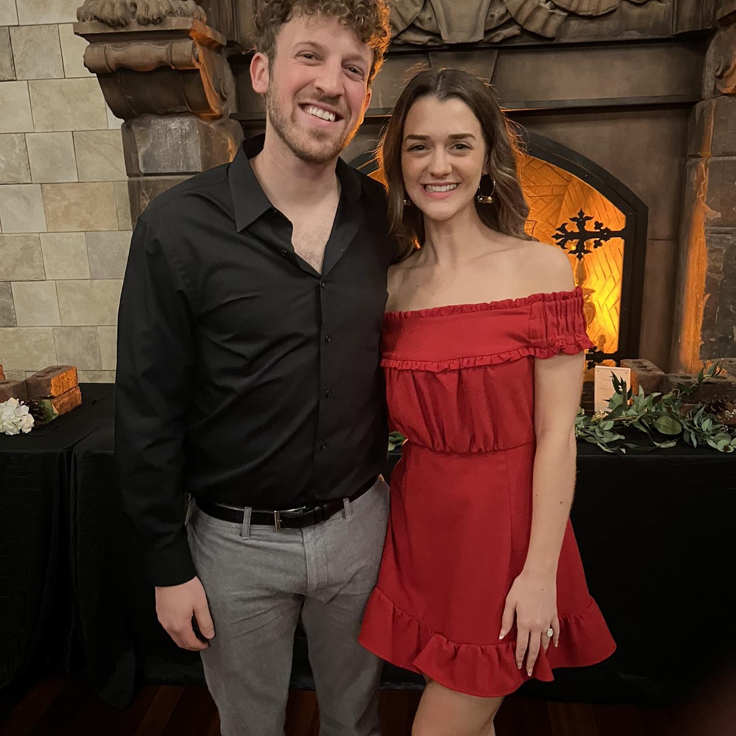 Aaron's work Christmas party, December, 2023. Meg getting to show off her ring just a few months after getting engaged.