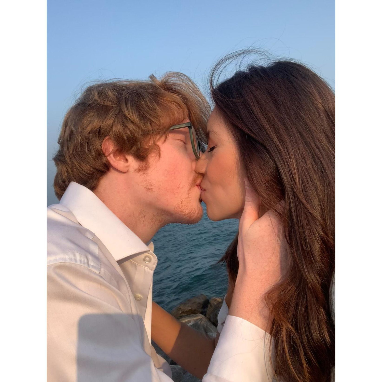 Back at the beach where it all began — our first kiss under the golden sky.