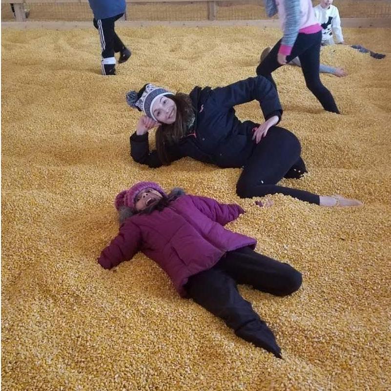 Ellie and Monica in the corn pit at Bengston's Farm
