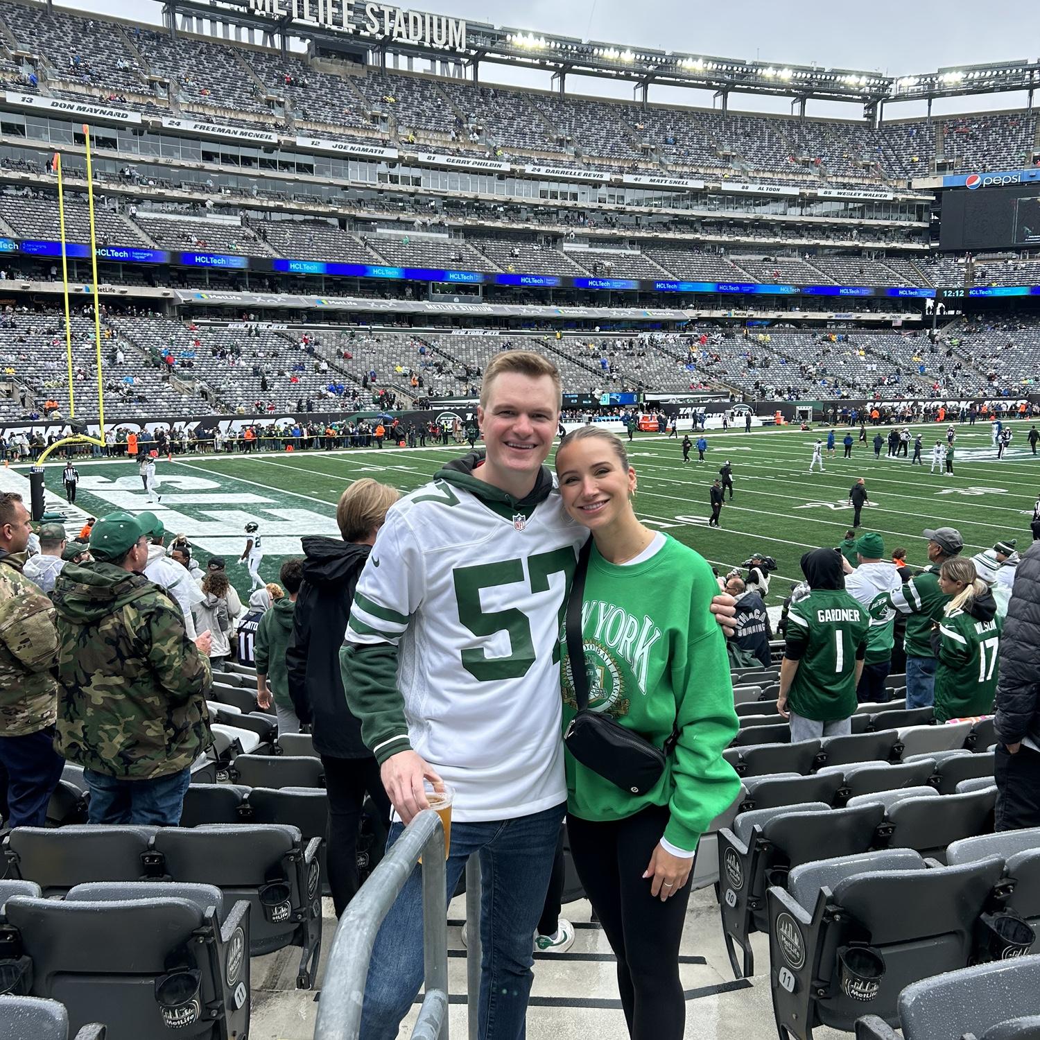 Travis took Lizzie to her first NFL game to cheer on the NY Jets!