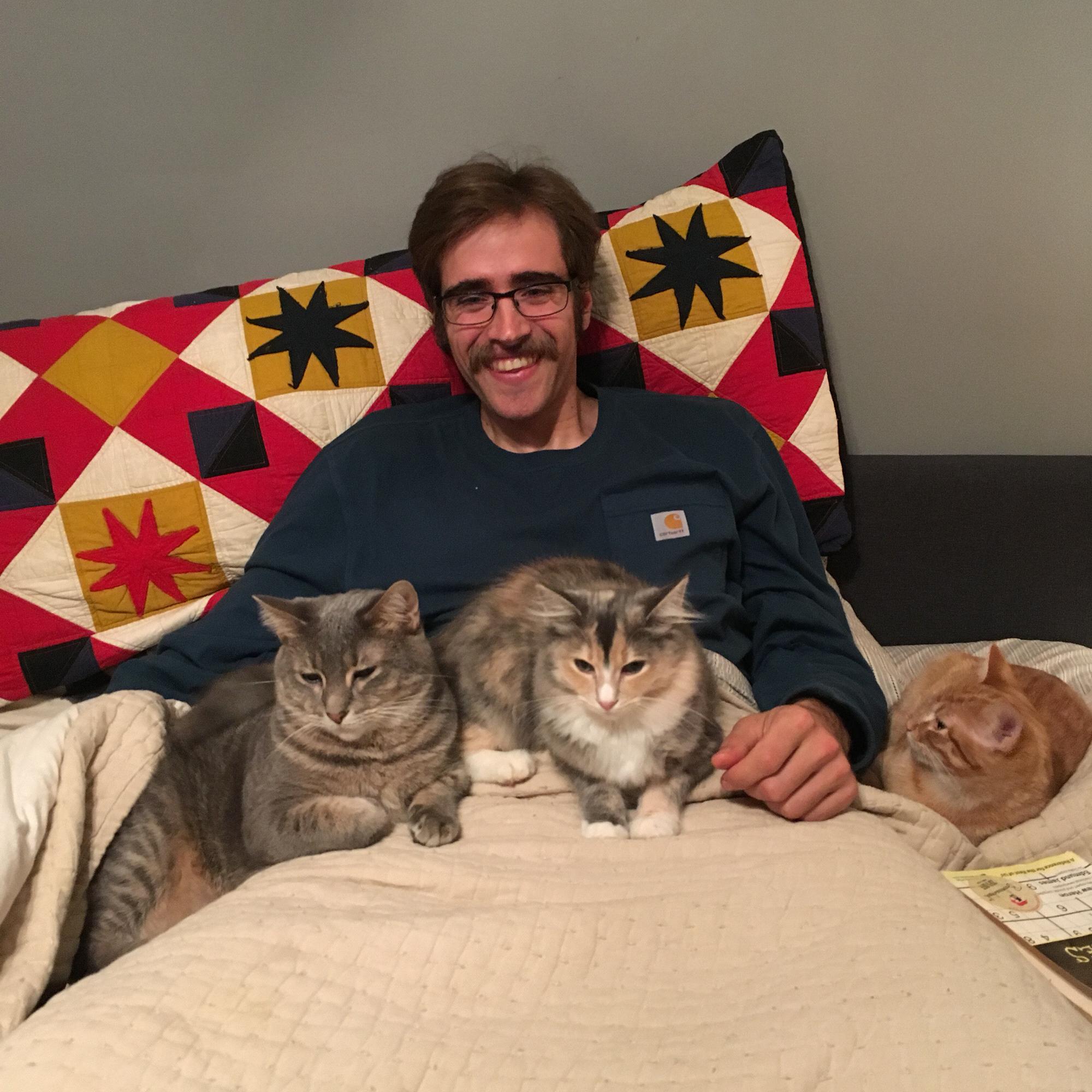 Kevin and #allthecats.
From the Left: Lenore, Fermat, Oscar