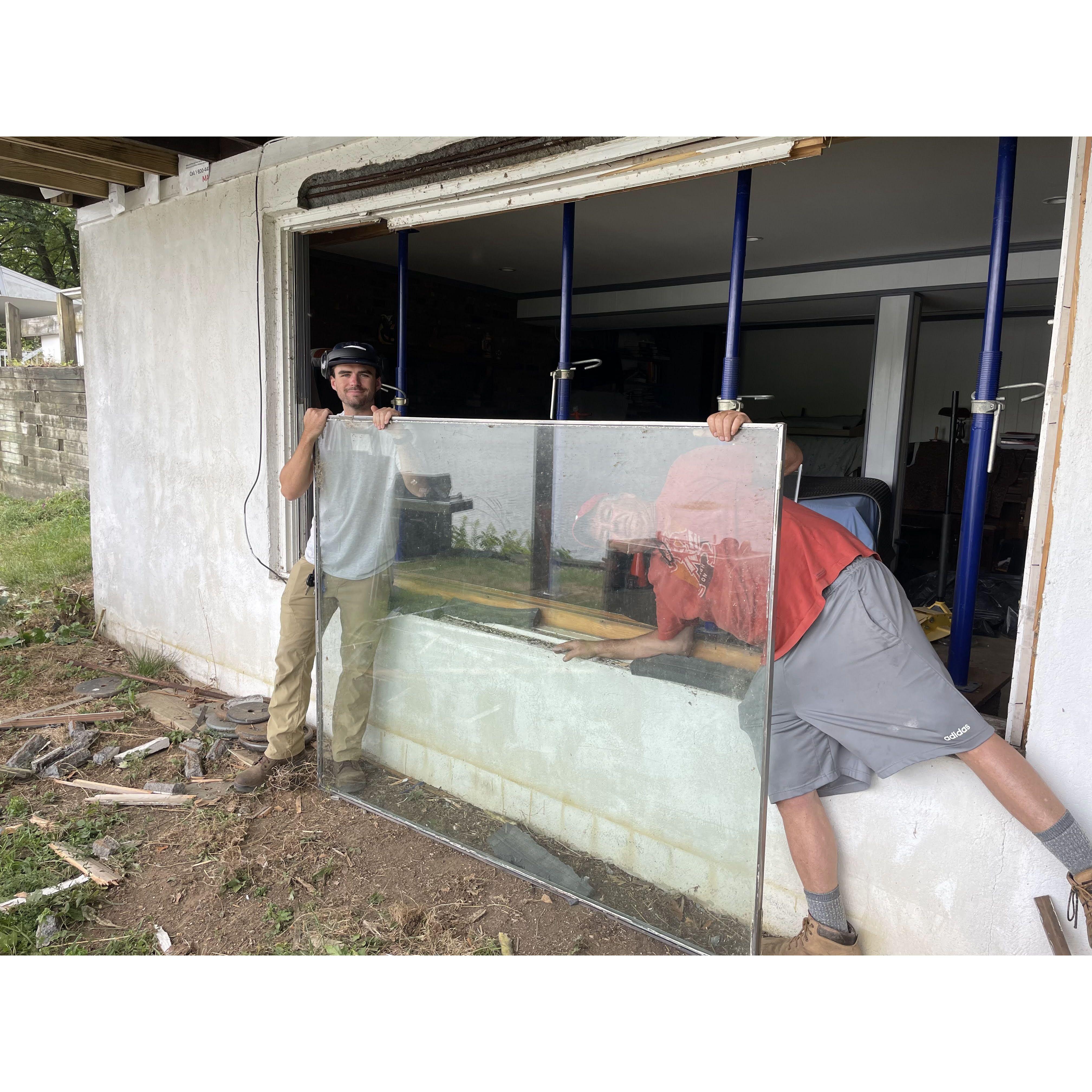 Matthew and Keith taking out the first floor window in preparation of replacing the header