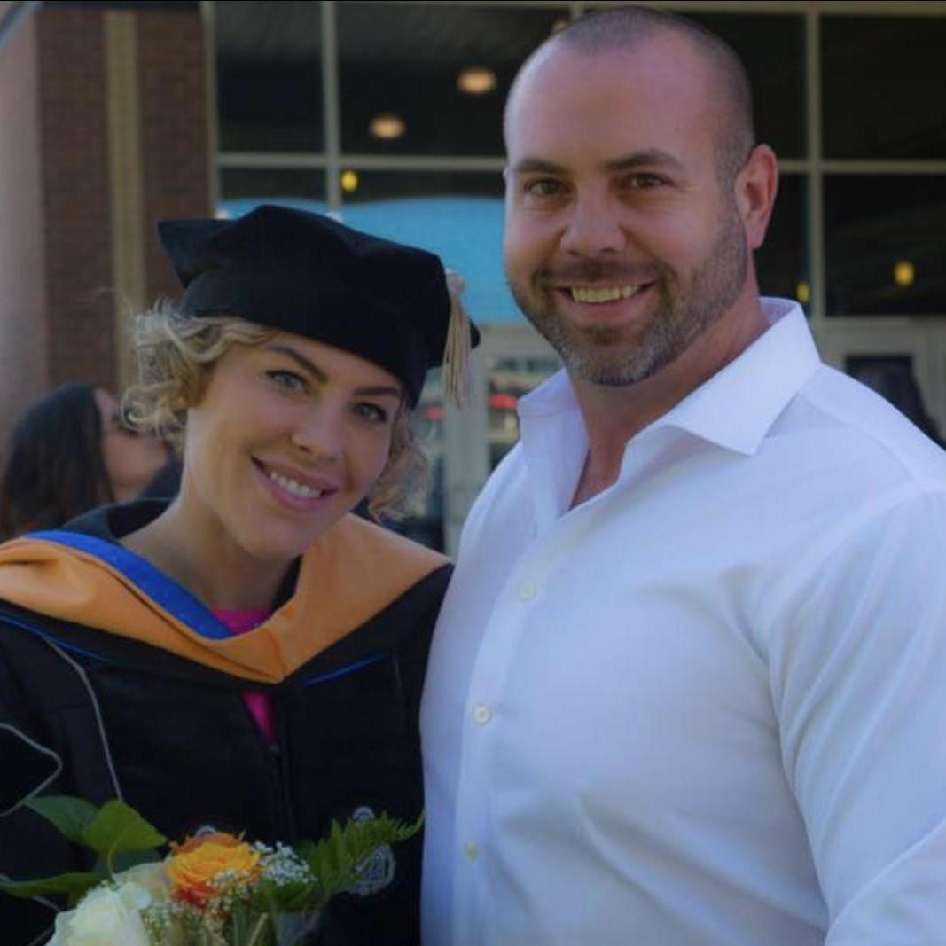 Dr. Christina Fisher and Dr. Burk Thomas by her side.