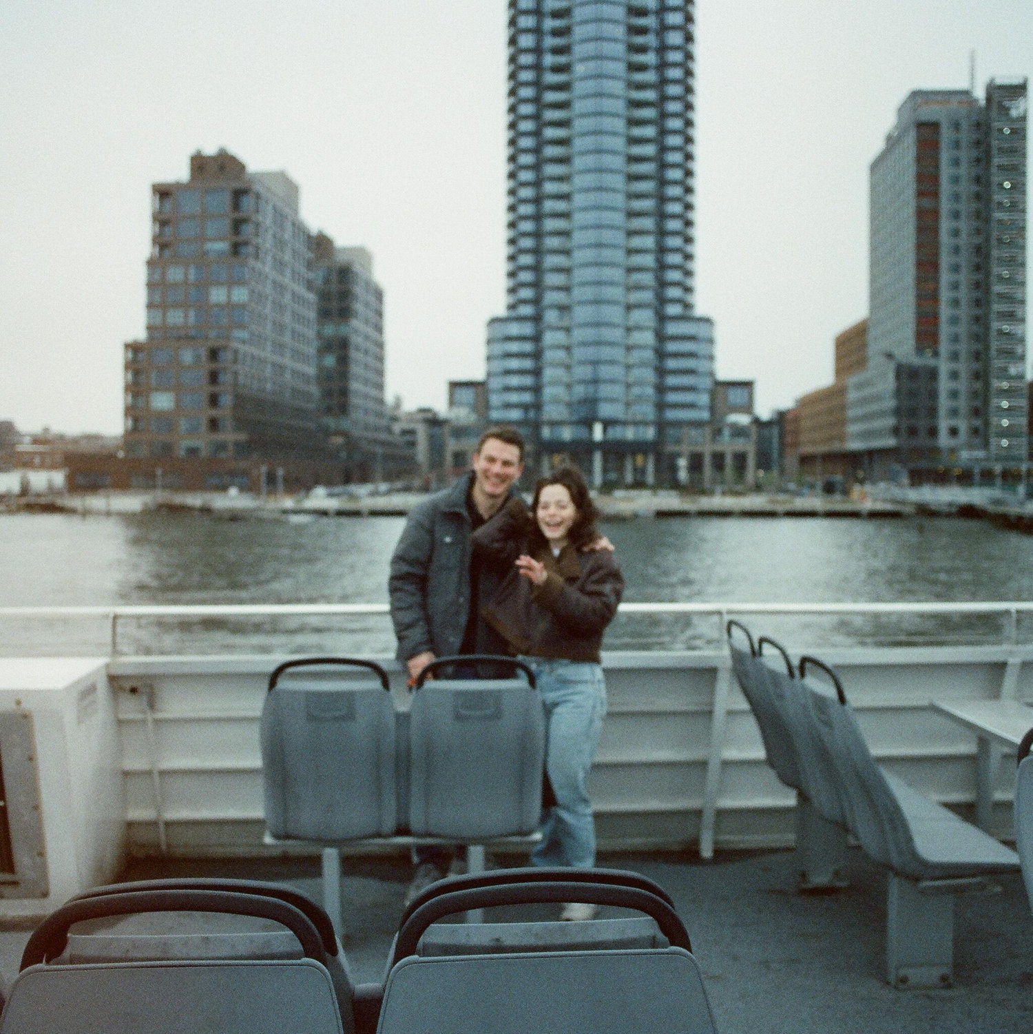 Three years after meeting, we found ourselves on top of the NYC ferry in our favorite seats, choosing to spend the rest of our lives together! A kind stranger captured that moment in this picture.