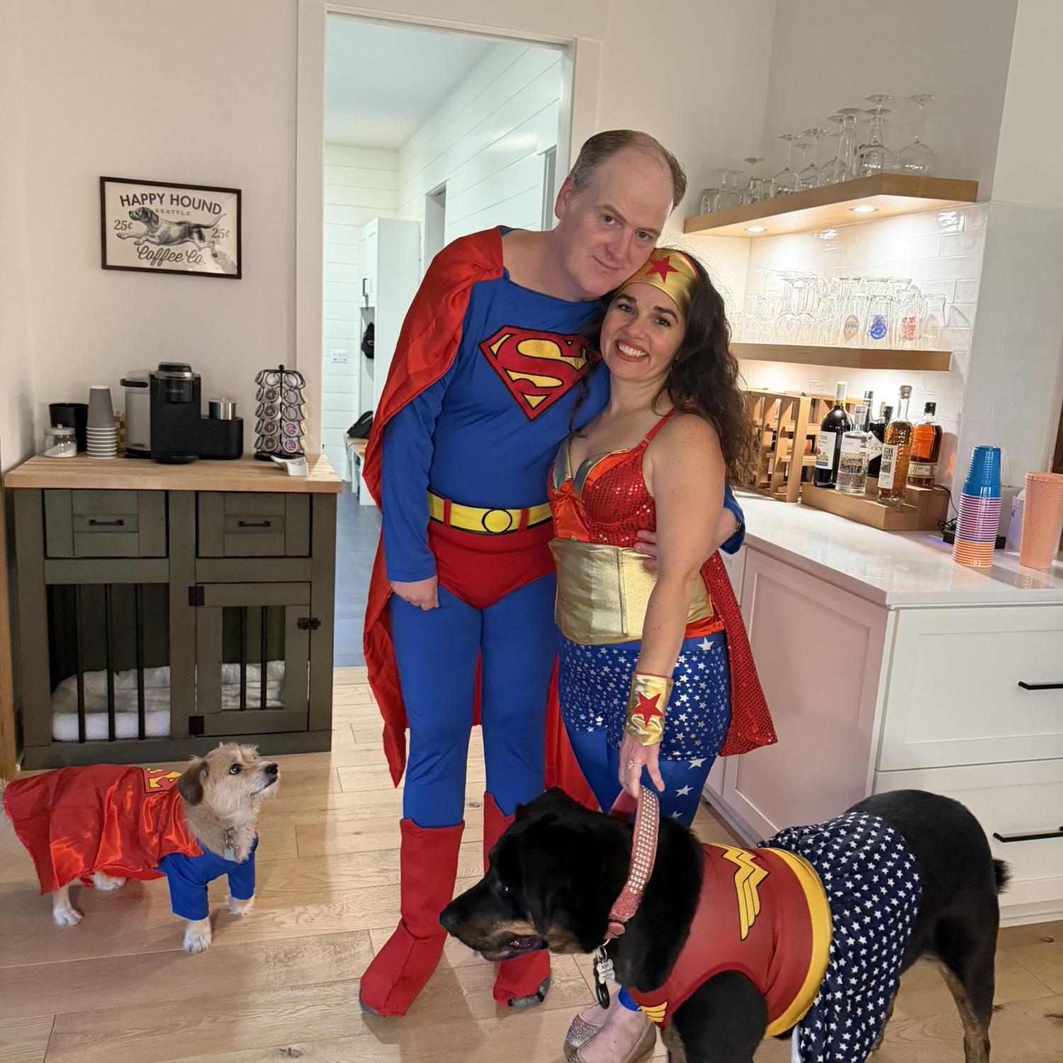 Superman and Wonder Woman, with Superdog and Wonder Dog.