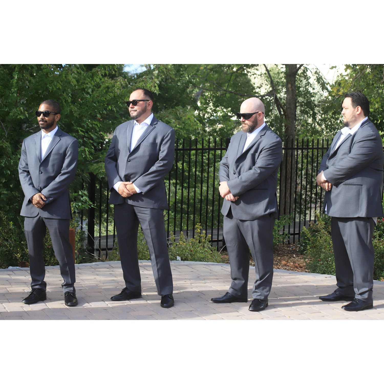 The Best Men looking handsome in their gray suits