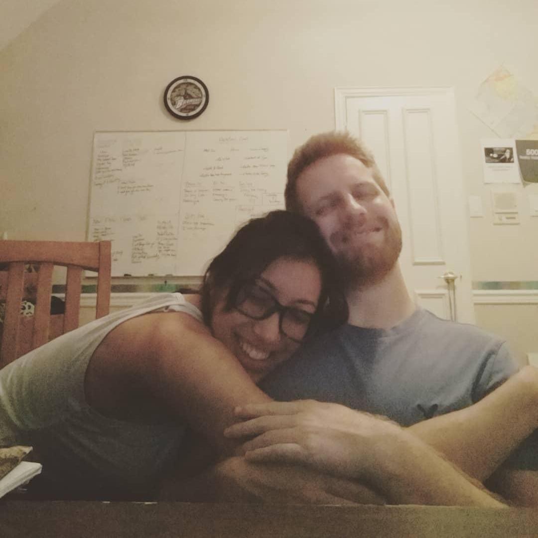 Taking a snuggle break between rehearsing songs