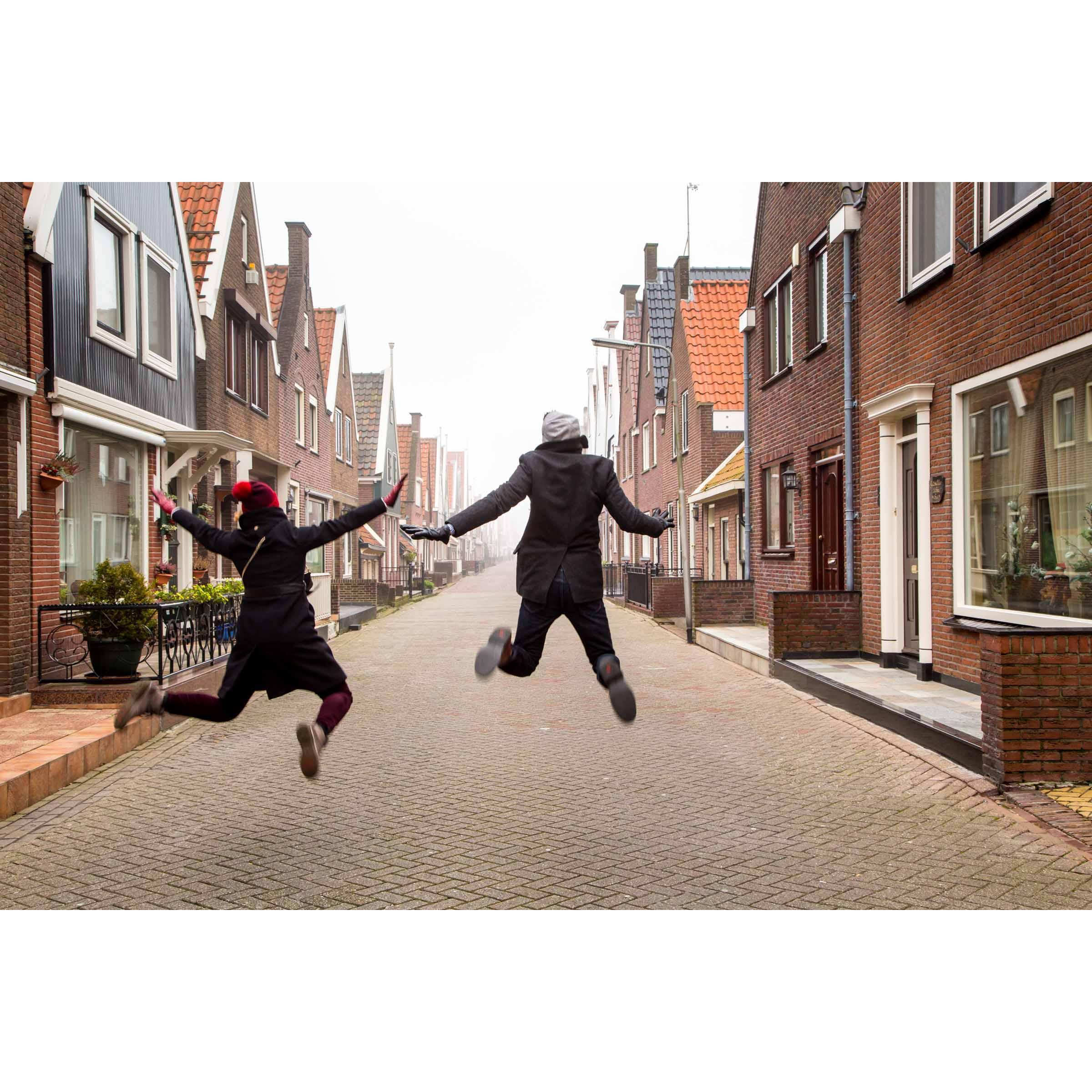 Jumping for joy on the streets of a village outside of Amsterdam.