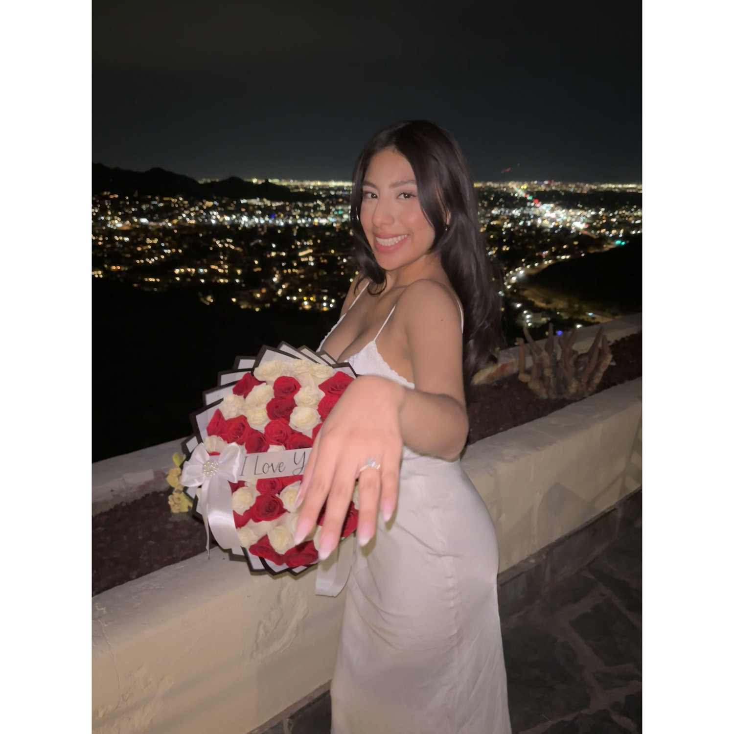 Showing off my ring at our engagement dinner after William proposed!
