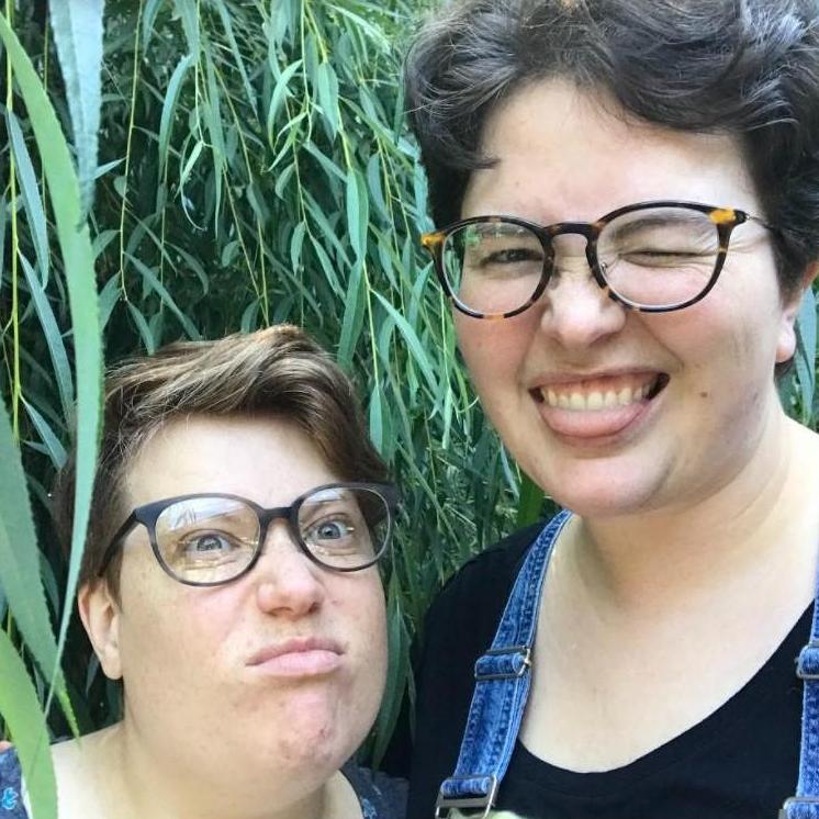 Posing in front of our neighbor's overgrown willow tree