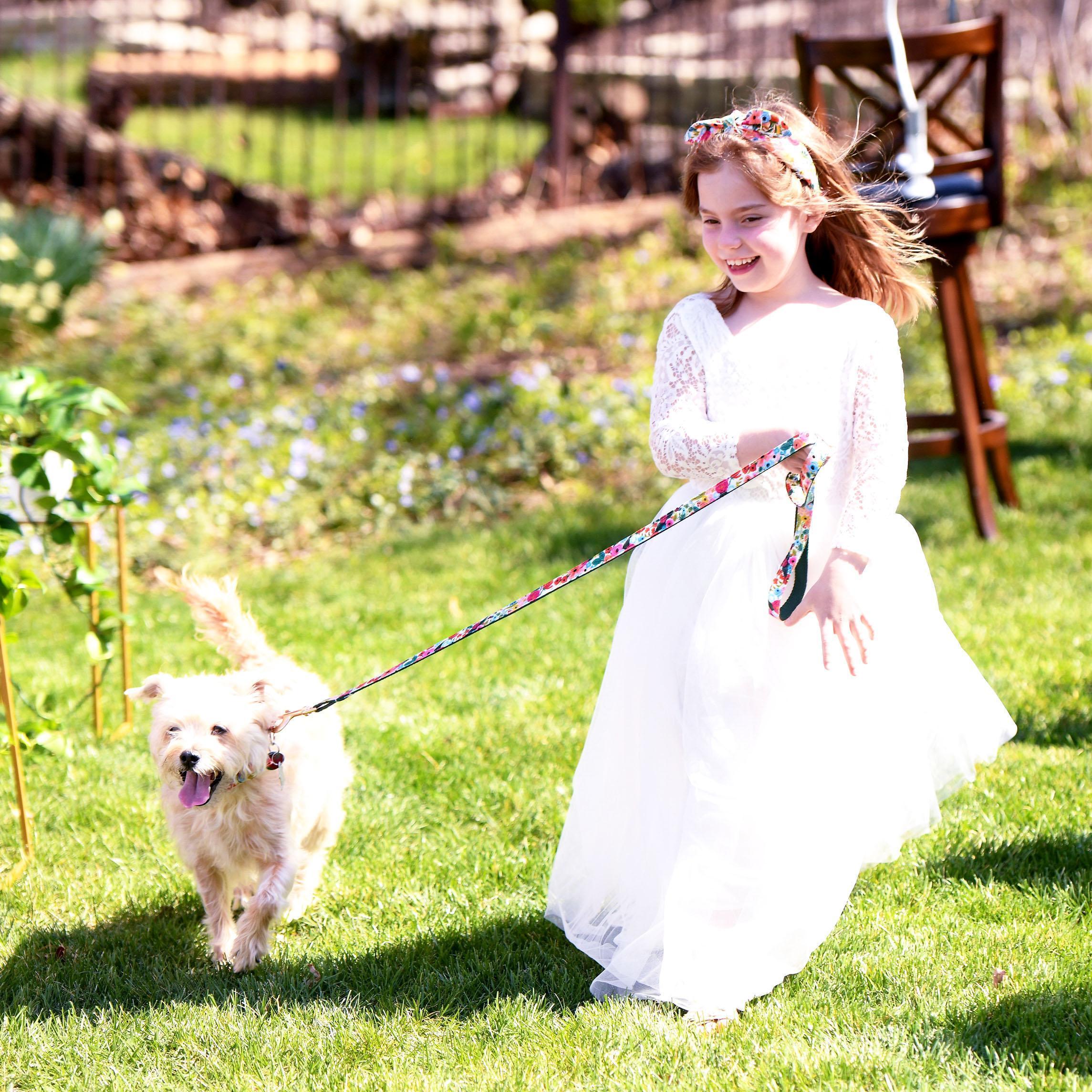 Quinn Hood and Oliver Wendell Holmes III (Ollie) raced down the aisle in matching florals. Quinn teamed up with her mother, Megan, and her sister, Zoe, to pick out beautiful flower girl dresses.
