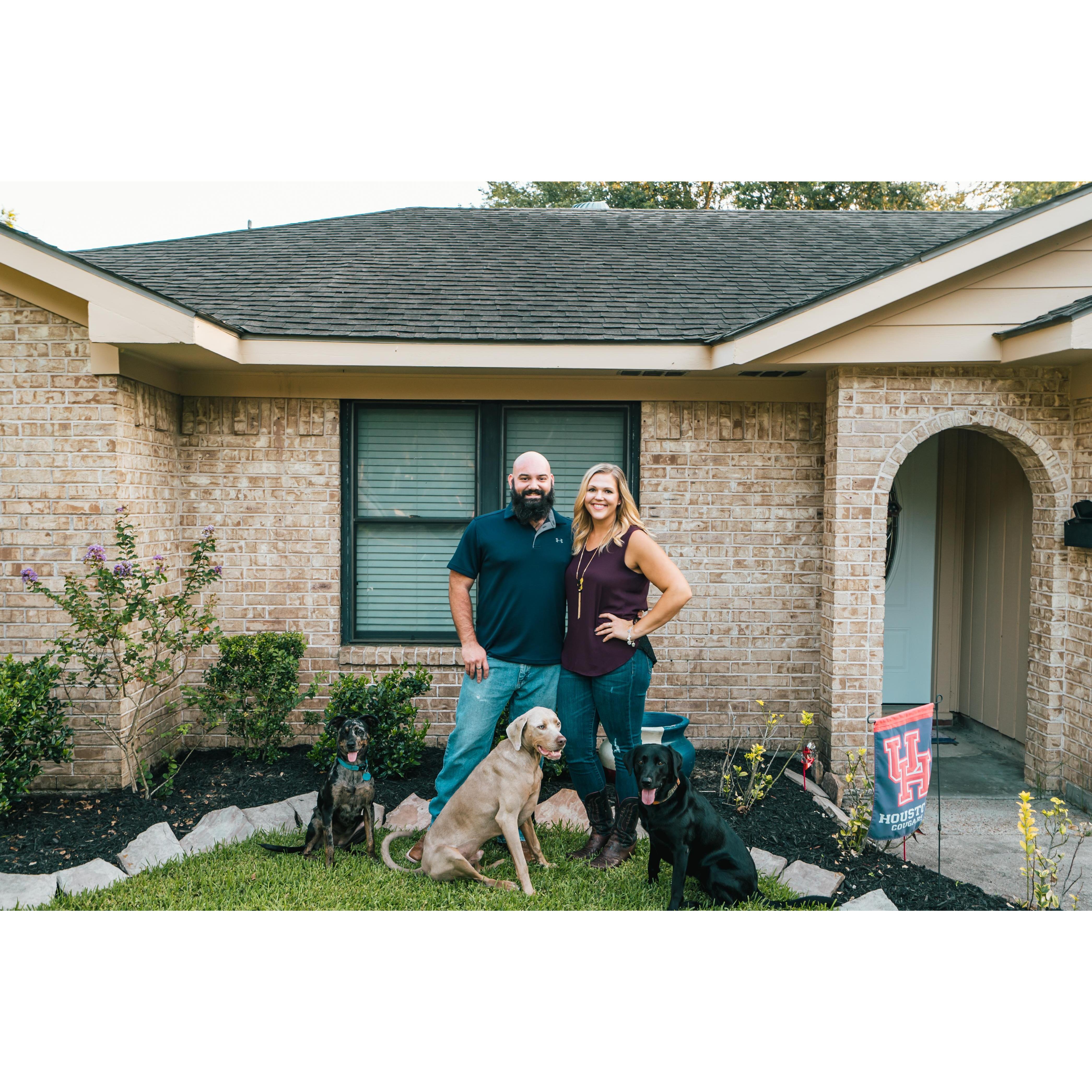 Our whole family in front our first home!