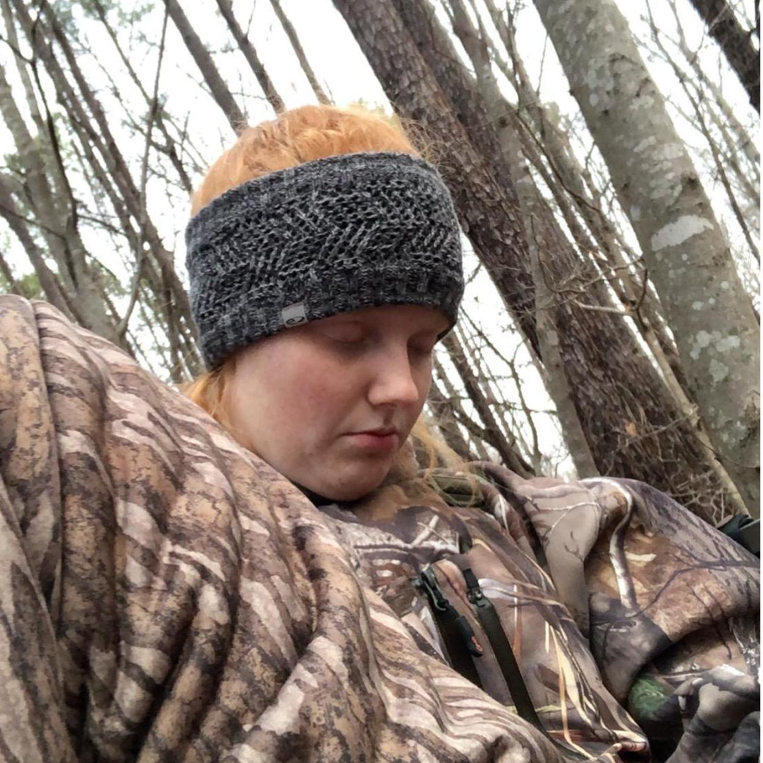 Erin asleep in the deer stand...