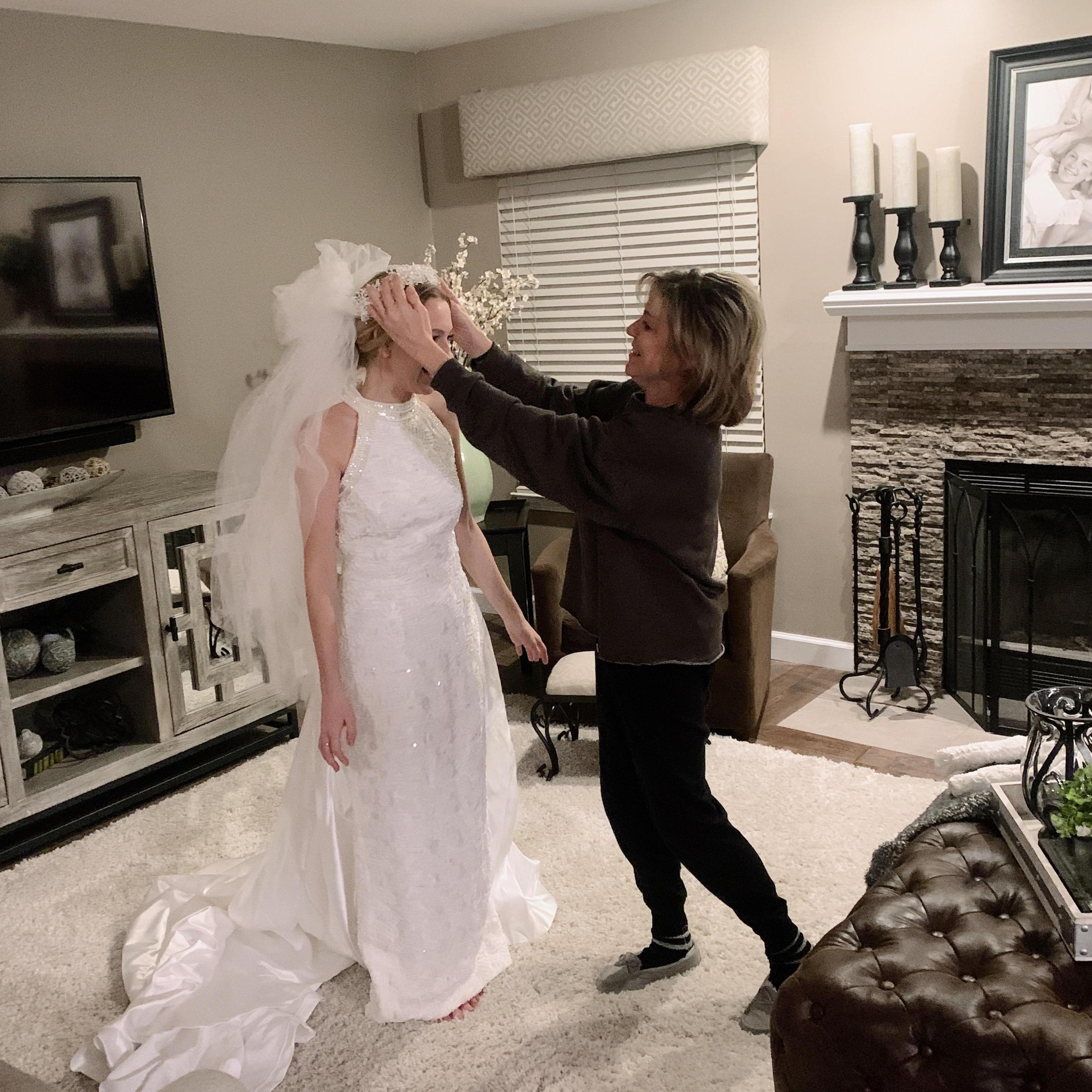 Trying on my mom's wedding dress.