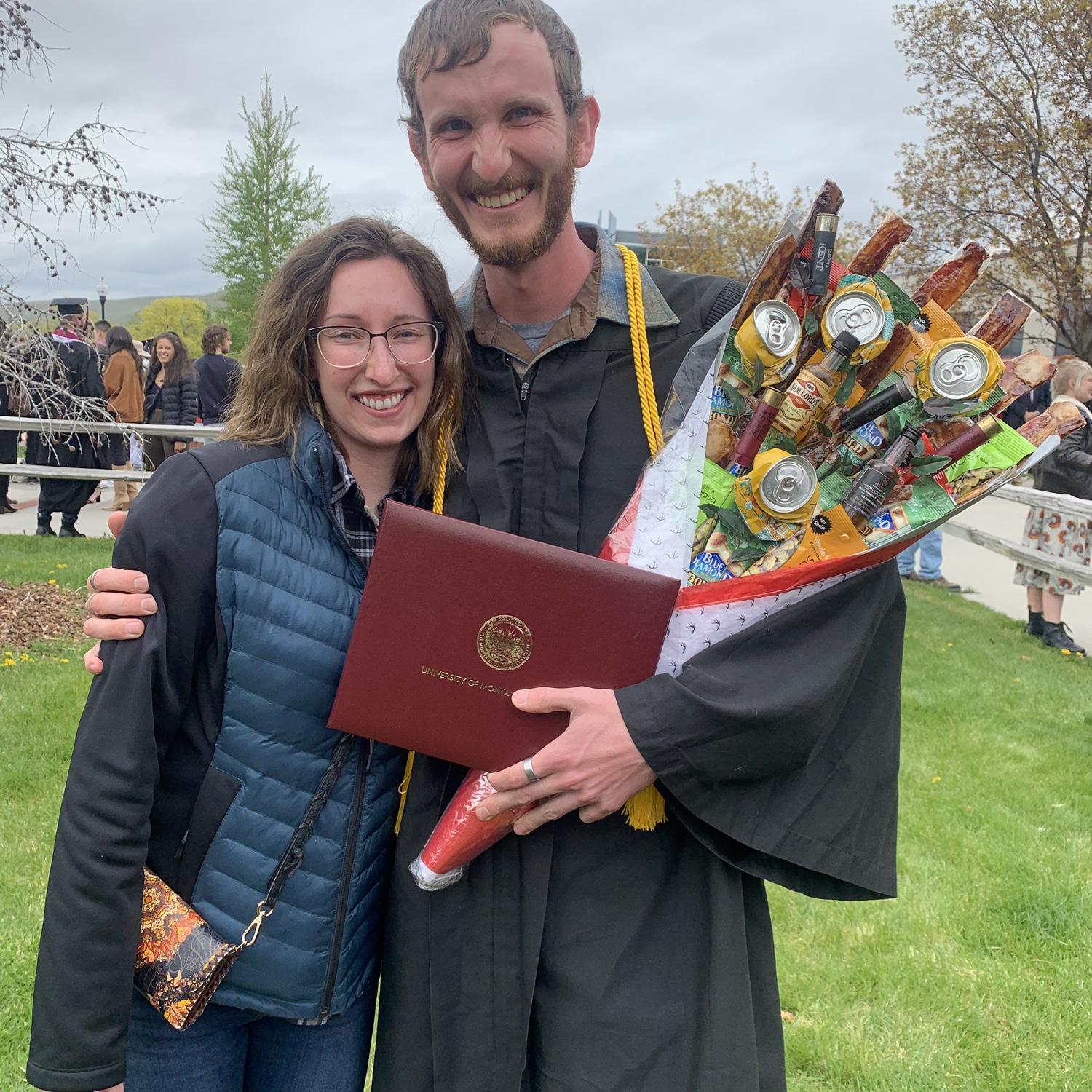 Riley's graduation with his bachelor's degree in Biology featuring the redneck bouquet I made for him. May 2022