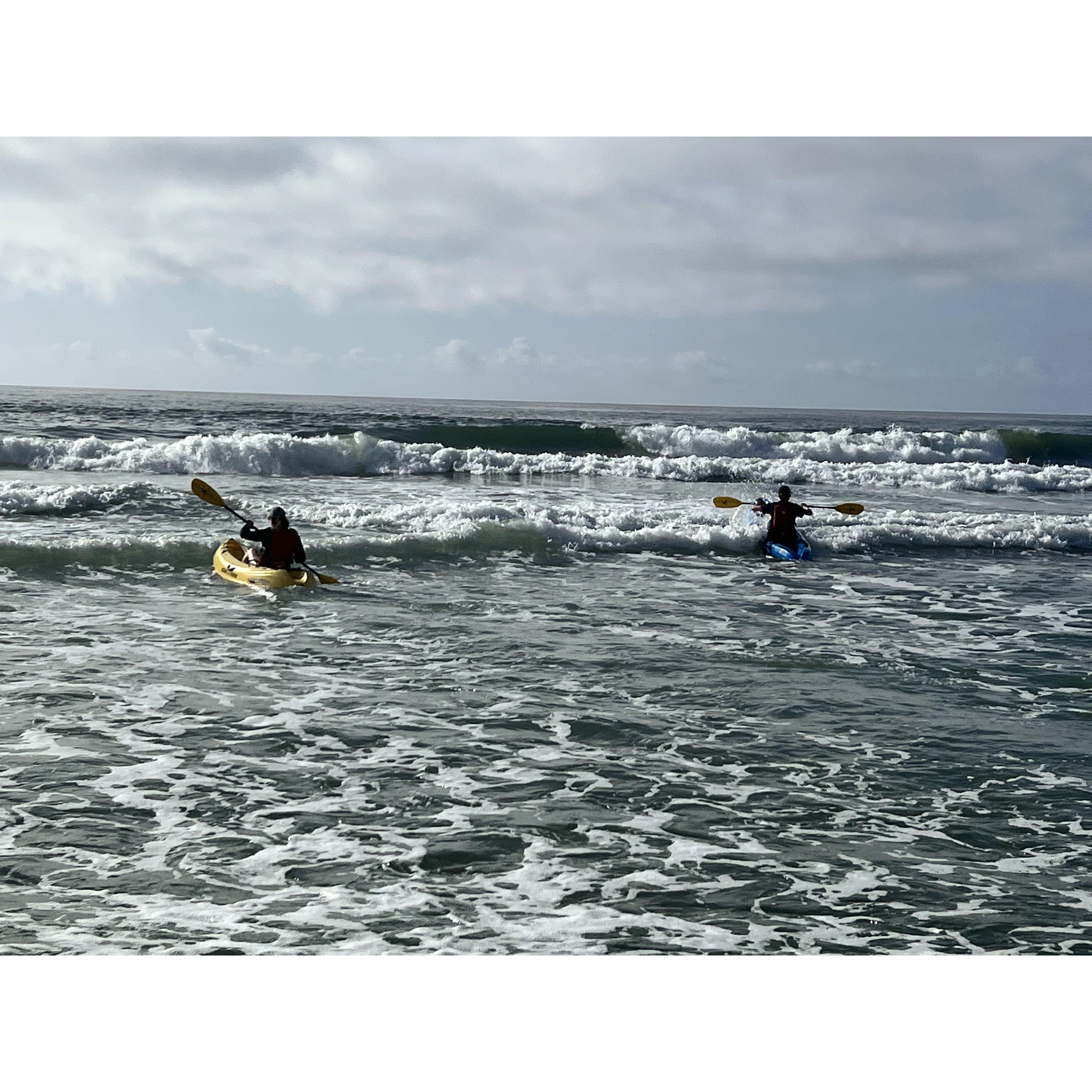 Olivia and Vince kayaking in the Ocean at Harvey Cedars in New Jersey in 2022.
