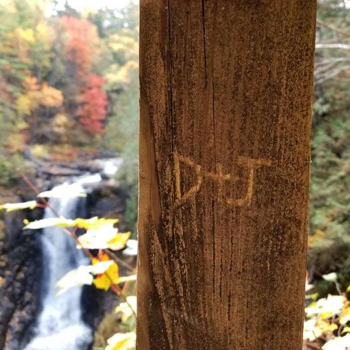 We carved our initials into the bridge overlooking the waterfall on the Moxy Falls trail in Maine, where Joe proposed.