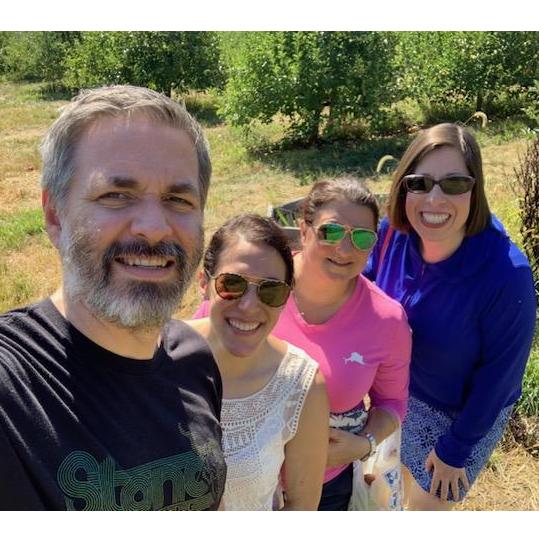 Brian regretted not having sunglasses on this trip to the orchard with Nancy and Nicole.