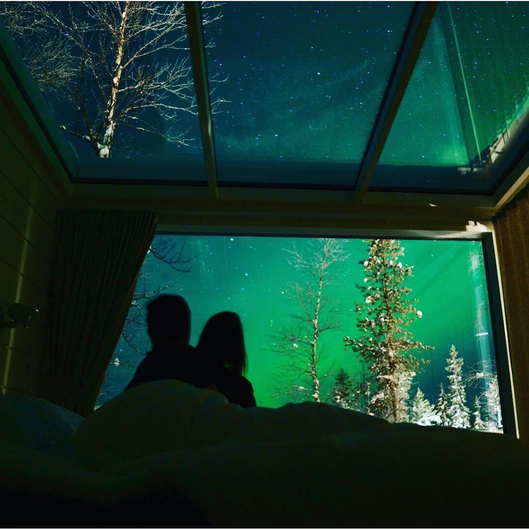 Watching the Northern Lights in a glass box in Finland!