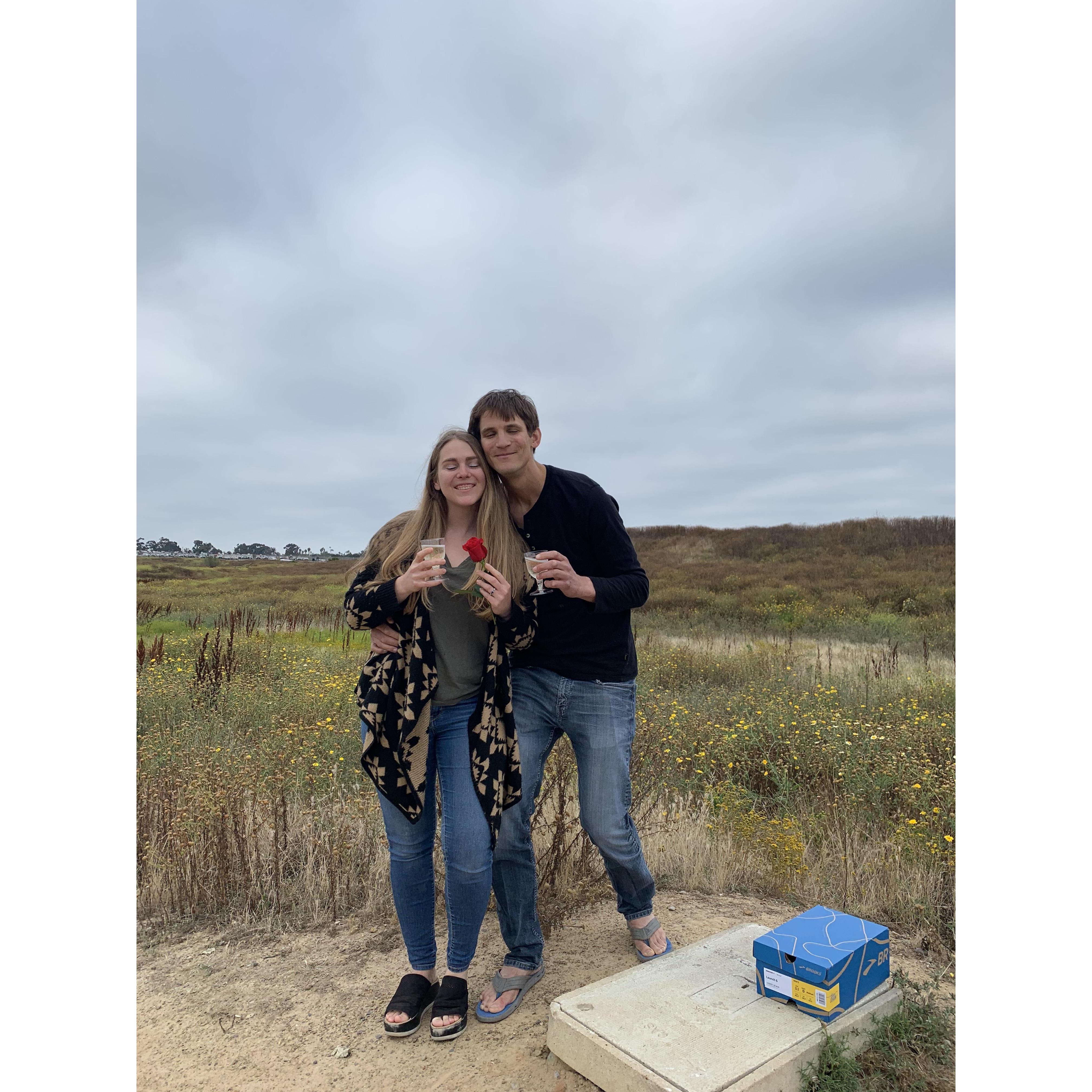 Our first pic after the proposal. Luckily, the box hidden in the bushes did not contain the human shit that Charlene expected, but rather a bottle of Prosecco.