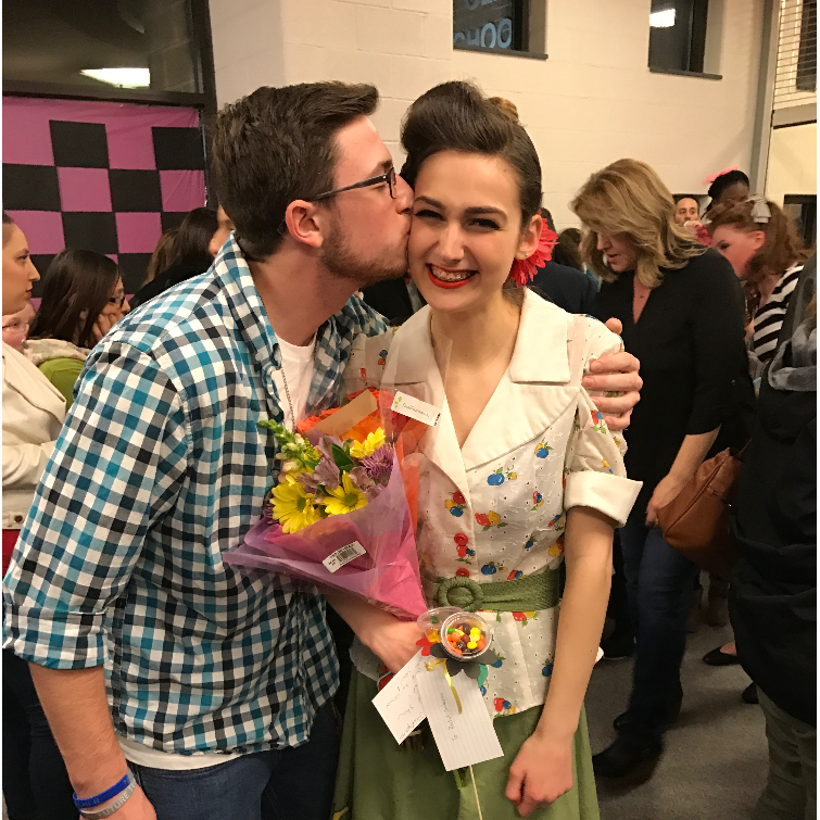 Supporting me at the school musical.