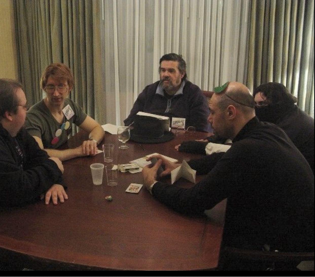 Gene playing games with his dad Dave Stern around a table at one of the Dreamation/Dexcon events.