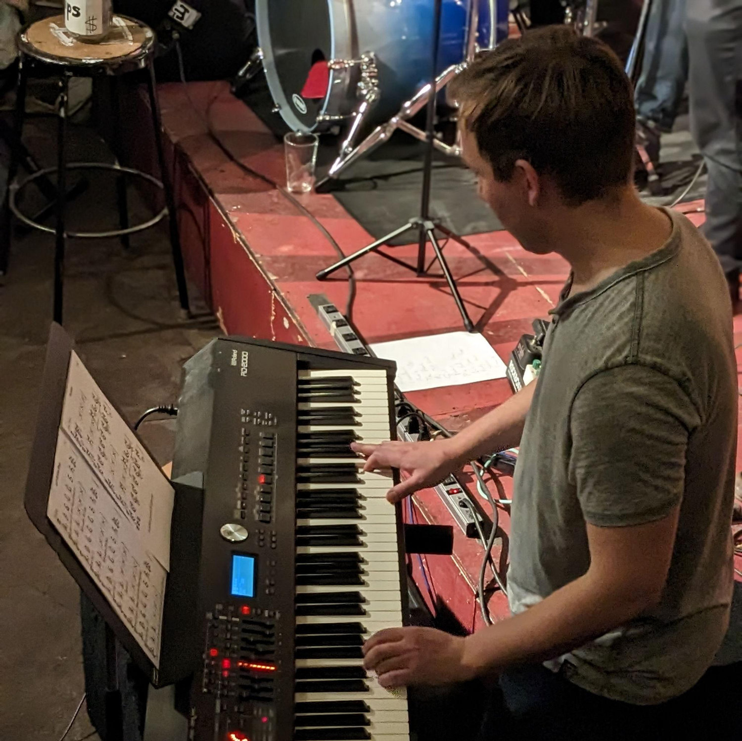 Lucas playing keys at Trident bookstore in Bolder, CO